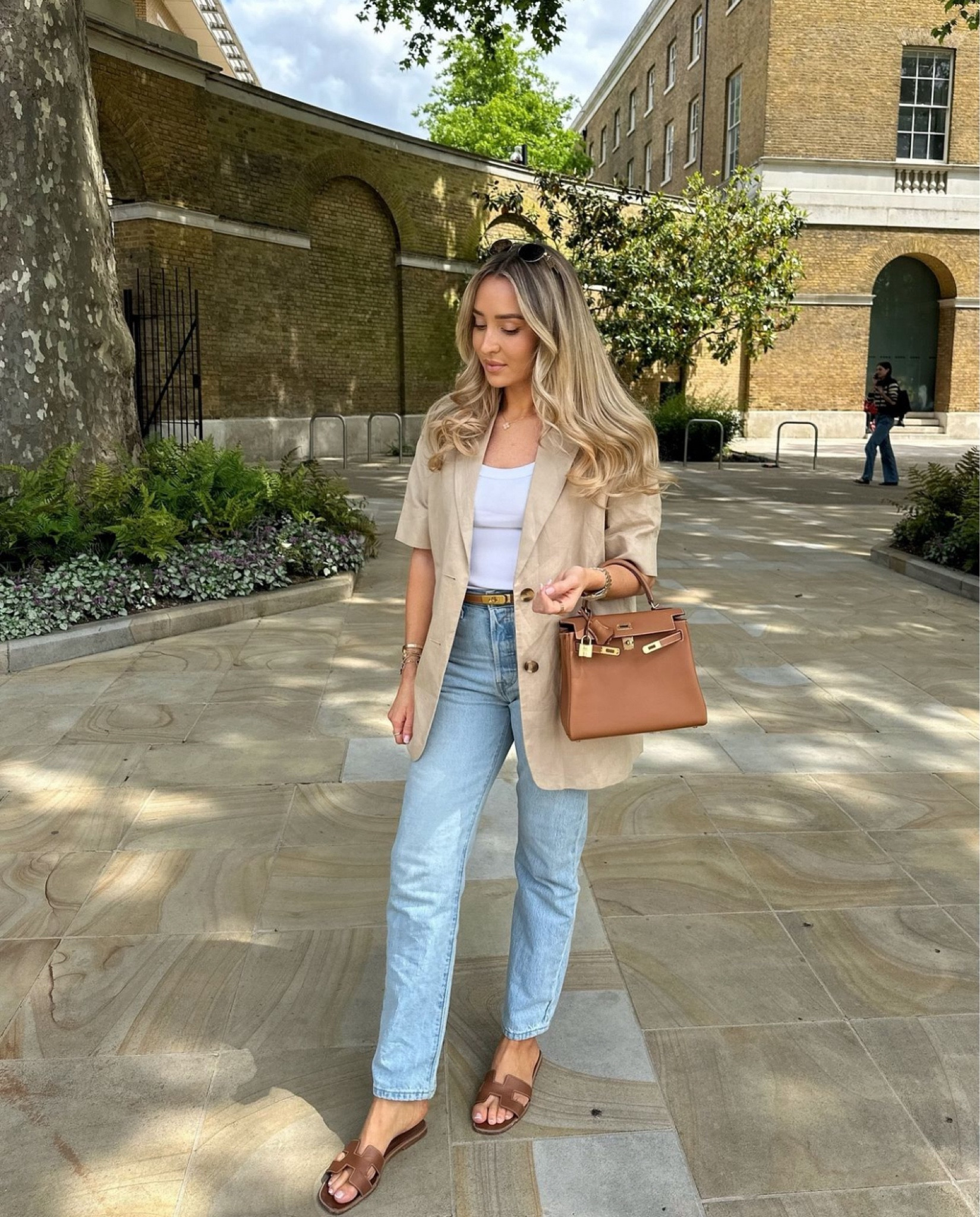 City Look 6 - short sleeve blazers and jackets are the perfect layering piece for these transitional outfits! Neutral smart and casual outfit with baggy blue jeans and tan Hermes accessories! I’ve attached a Hermes dupe from M&S - so cute!

#LTKuk #LTKautumn #LTKsummer