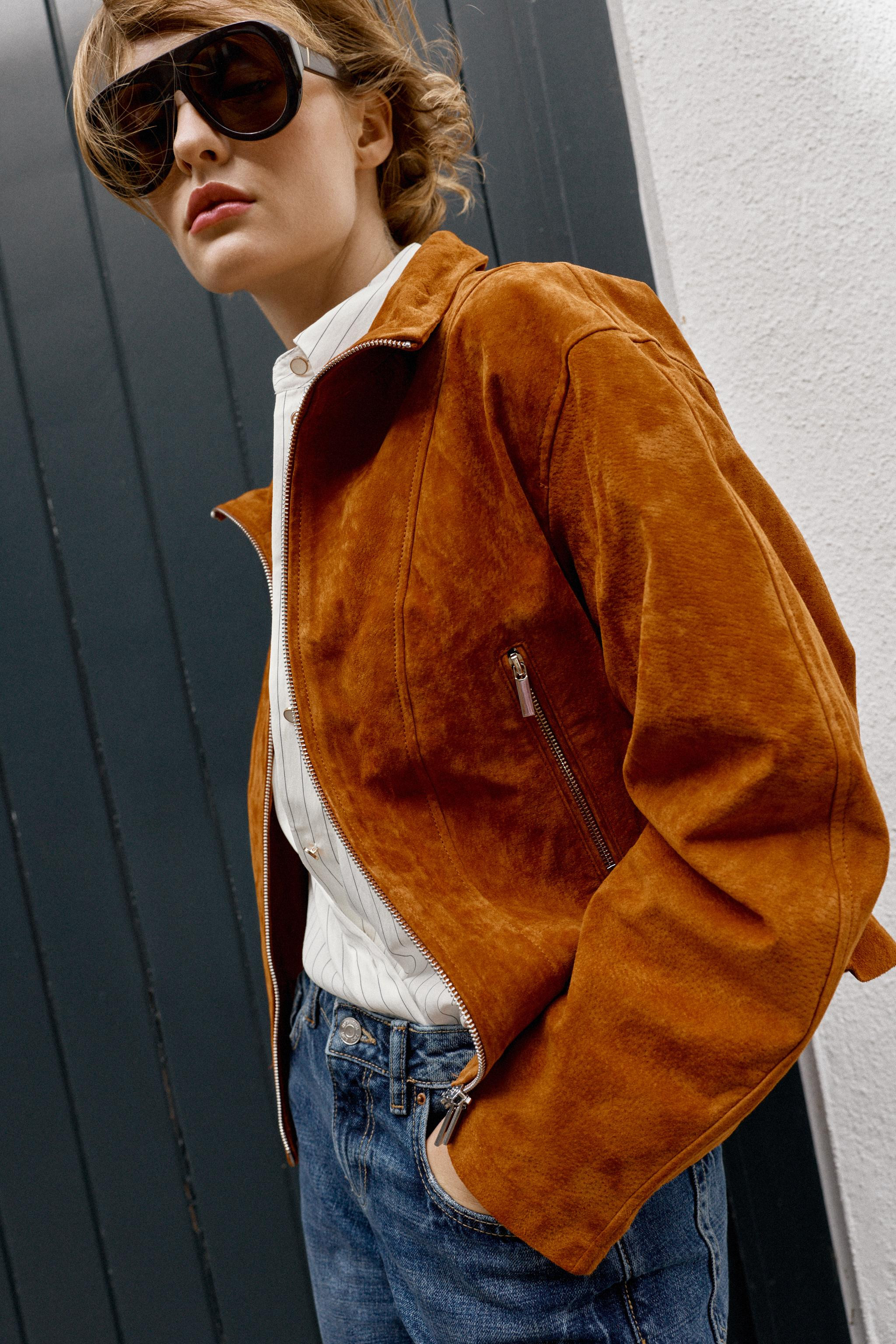 Jacket crafted from 100% premium leather. Features a stand collar, long sleeves, and front pocket... | Zara US