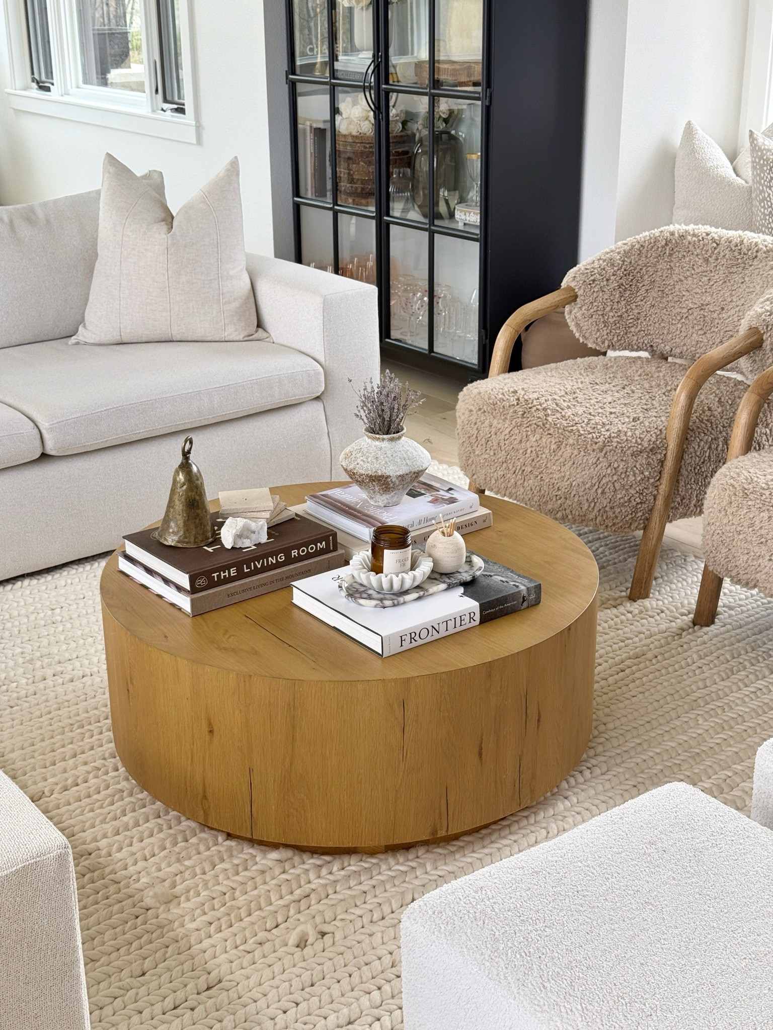 Coffee table styling 🙋🏻‍♀️ books, marble tray, dried lavender in a ceramic vase, vintage cow bell, crystals, non-tox candle and stone coasters 👏🏻 

Home decor
Spring living room

#LTKSeasonal #LTKHome