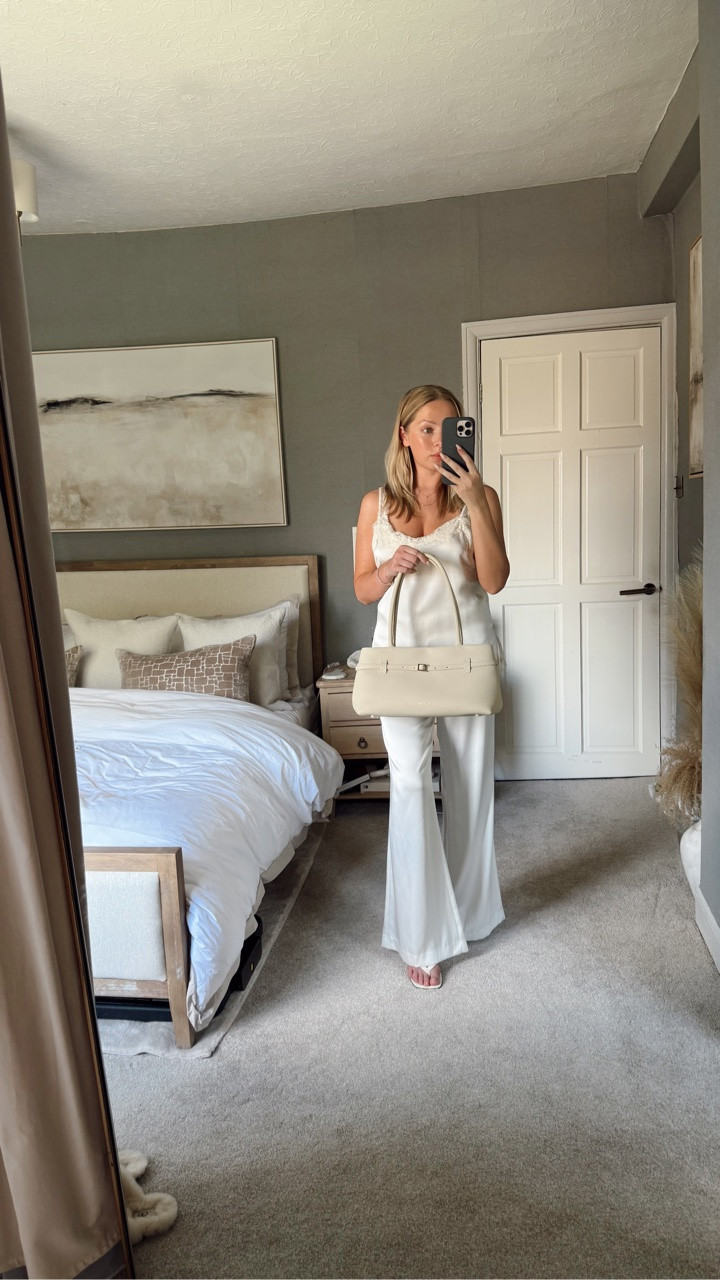 Head-to-toe silk because if I’m going to romanticise my life, I might as well commit. 🤍✨ Now excuse me while I avoid sitting on literally anything that could crease this outfit

Top @mango 
Trousers @zara 
Shoes @sheinofficial 
Bag @manu_atelier 
Perfume @armanibeauty - gifted 

#quietluxury #silkstyle #elegantstyle #neutralstyle #classyoutfit @bootsuk @wpp 
GIFTED

#LTKeurope #LTKmodest #LTKshoes