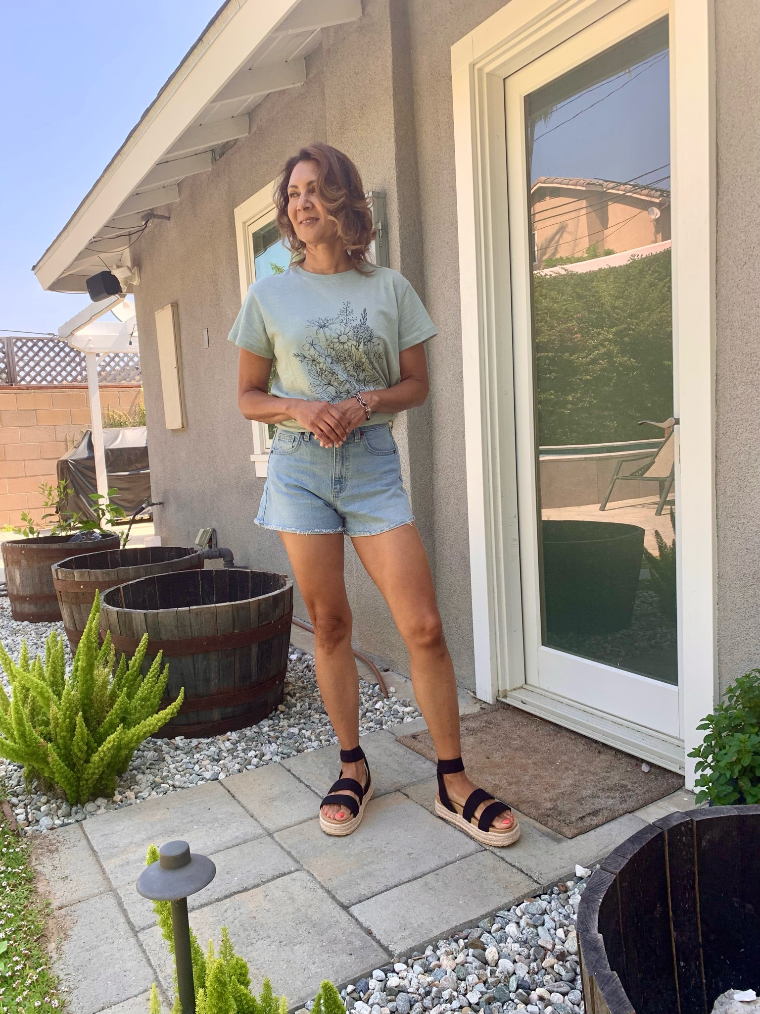 Backyard outfit idea - I’m hanging out in the yard and loving my comfy shorts (size 2) and graffic tee (size S) from Target.  At platform sandals to complete the look.  Tap any photo to shop.  

#LTKFindsundet50

#LTKSeasonal #LTKSummerSales #LTKOver40