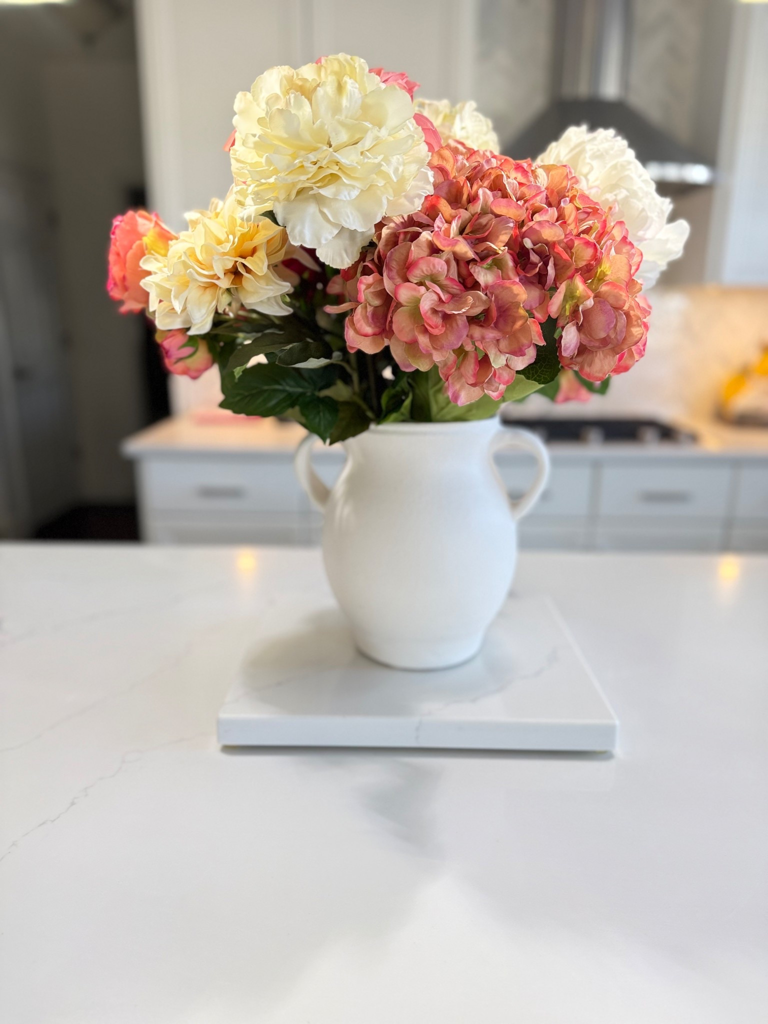 Spring is in the air! I was decorating yesterday and headed to the basement to find some spring flowers! Got everything I needed! I couldn’t decide do the life of me how I wanted it arranged! Cut the flower stems or bent some of them to fit in the vase! Everyone's got their own way of doing things! Finished decorating by 9pm last night! 🌸🌸 @shop.ltk #sale Check out Easter decor! 

Flowers @hobbylobby 
Vase @potterybarn 

#spring #flowers #decor #easter

#LTKvlog #LTKHome #LTKdayinmylife