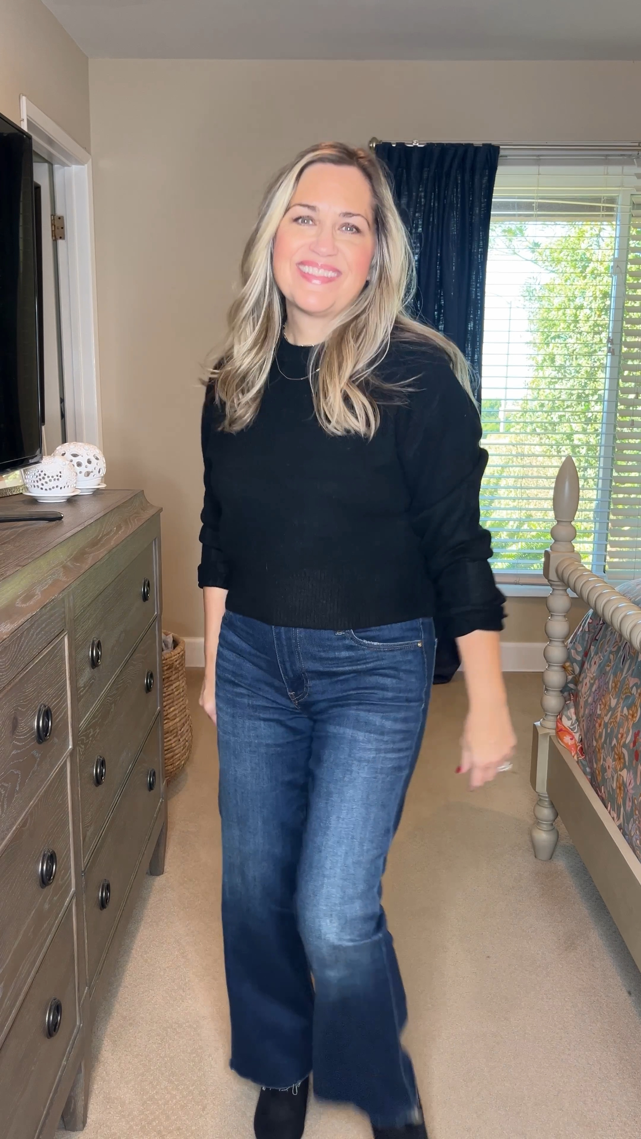 The simple formula always works: A great pair of jeans, a black top and black boots. This will keep you looking chic no matter where you are going can easily be layered with acute jacket or blazer to make it more casual or dressier. Wearing XS in sweater, jeans are2