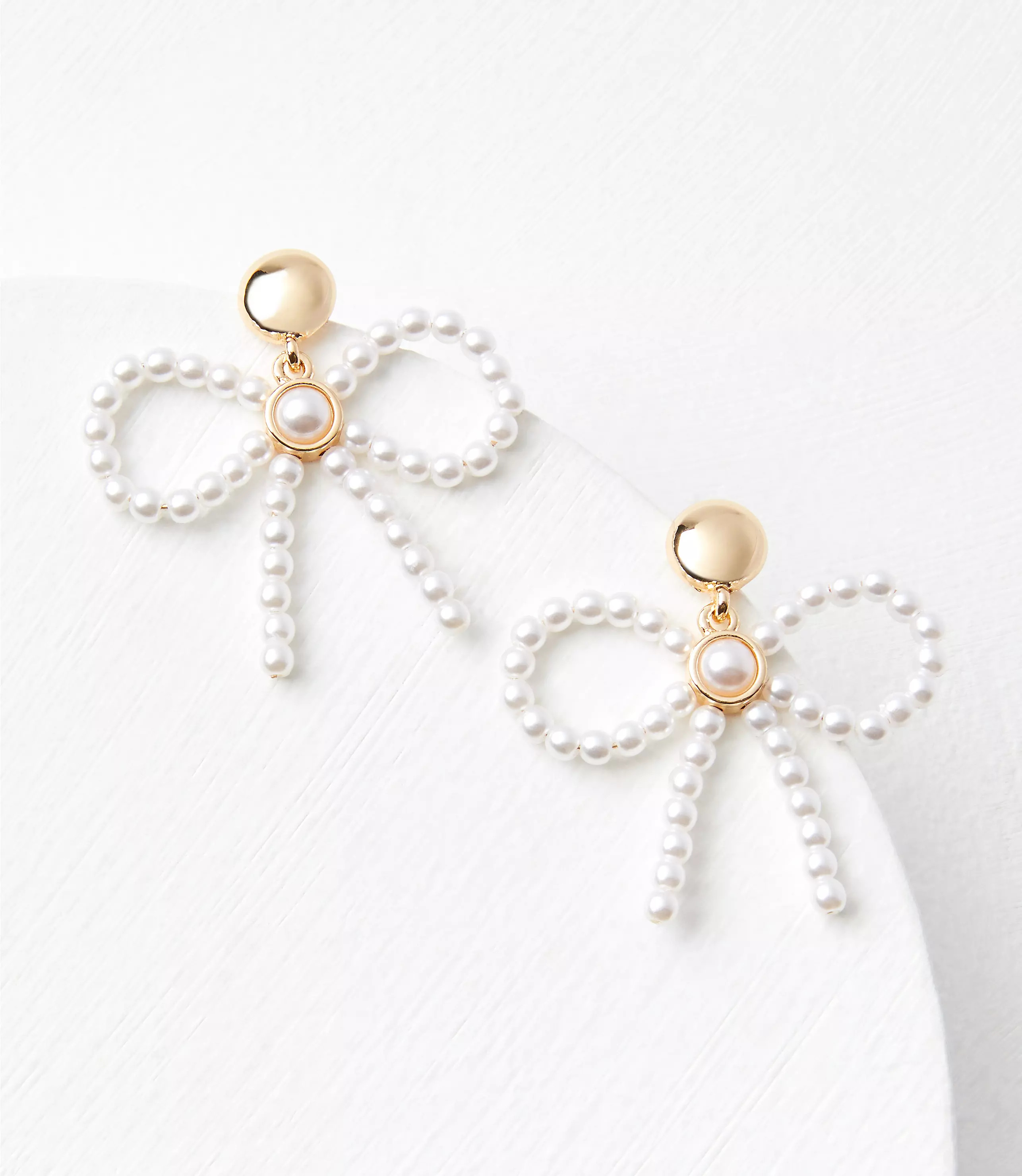 Pearlized Bow Statement Earrings | LOFT