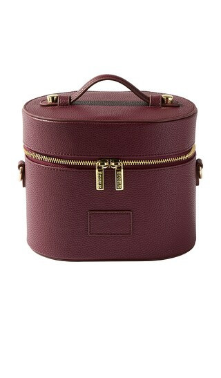 ETOILE COLLECTIVE Oval Toiletry Case in Burgundy. | Revolve Clothing (Global)