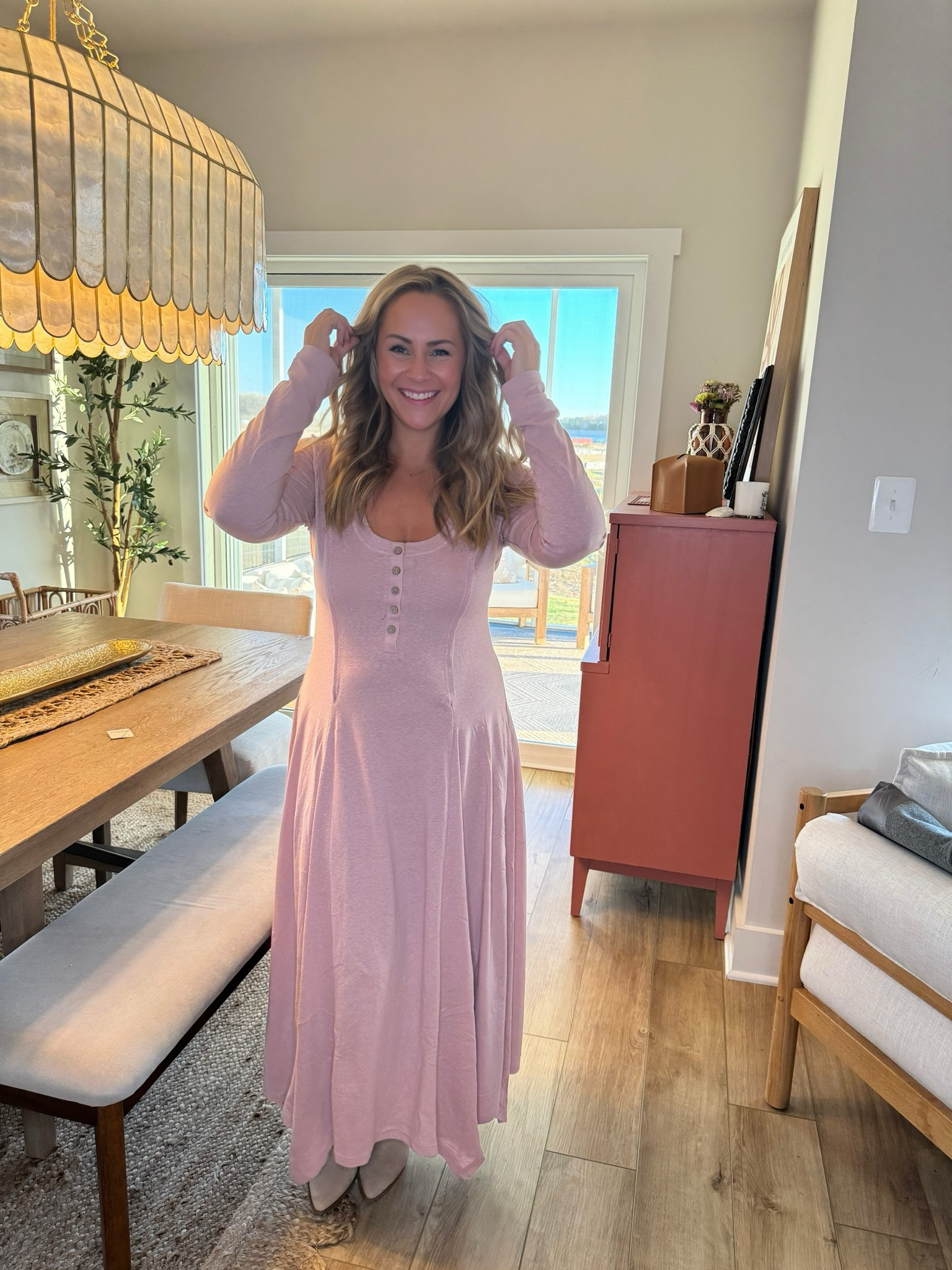 The henley maxi from Free People in light pink features long sleeves, a cozy, chic design with a relaxed fit and an A-line skirt. 

#LTKHoliday #LTKmidsize #LTKstyletip