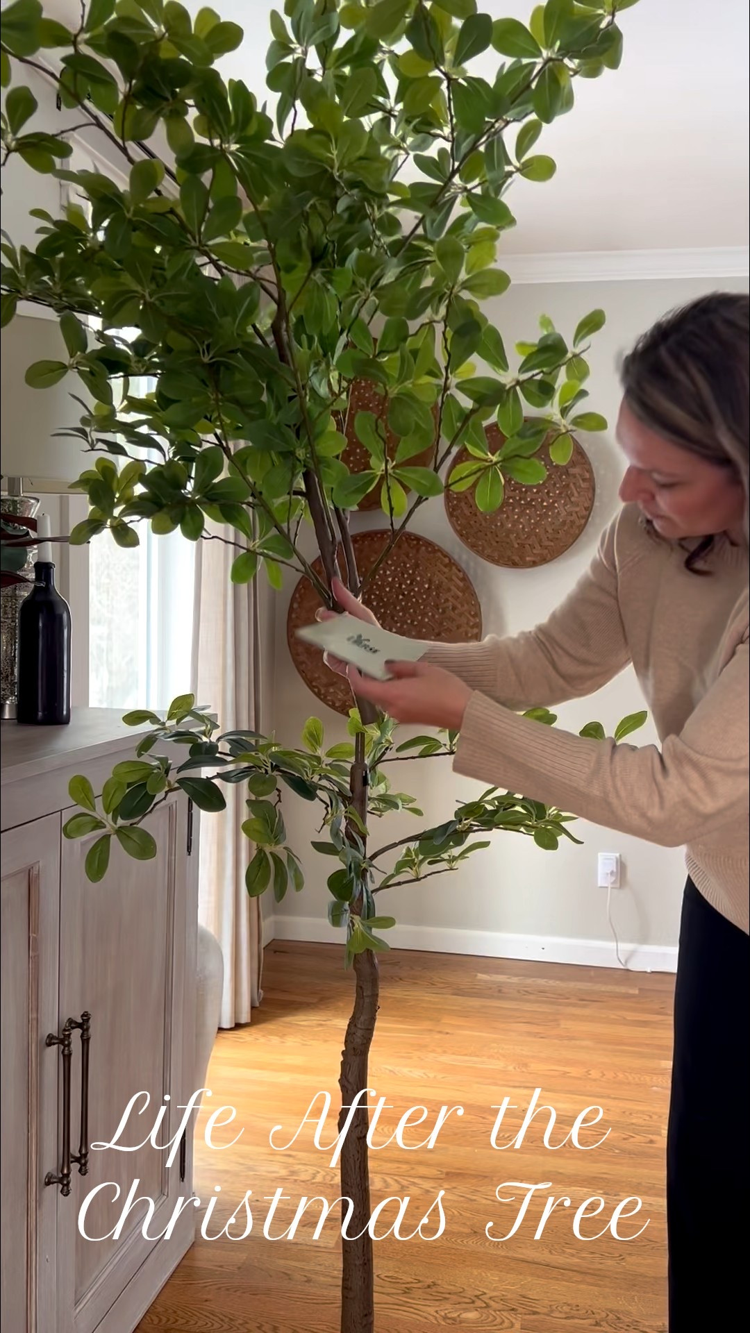 Tall faux trees are the secret to styling empty corners and entryways. Olive and black olive trees add height, texture, and visual interest while keeping a space feeling warm and intentional all year long. A simple swap that replaces the Christmas tree feeling and makes rooms feel finished.