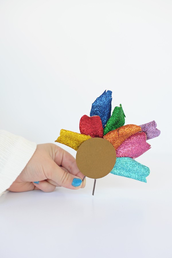 These cute little glitter turkeys are a great project for little ones while you cook dinner. Have older cousins take the little ones to gather leaves and sticks on a nature walk. Cover the leaves with craft glue and fine glitter. Let dry. Punch out or cut a cardstock circle for the body. Have an adult hot glue the leaves to the circle and sticks for legs and add goggle eyes if you want for a fun touch. SO cute and easy!! Here are the supplies we use...

DIY | Craft | Project | Crafting | Turkey | Thanksgiving | Kids | Kid's Craft | 

#ltkkids #ltkfindsunder50 #ltkhome #ltksalealert  

 #LTKHoliday #LTKmomlife #LTKSeasonal