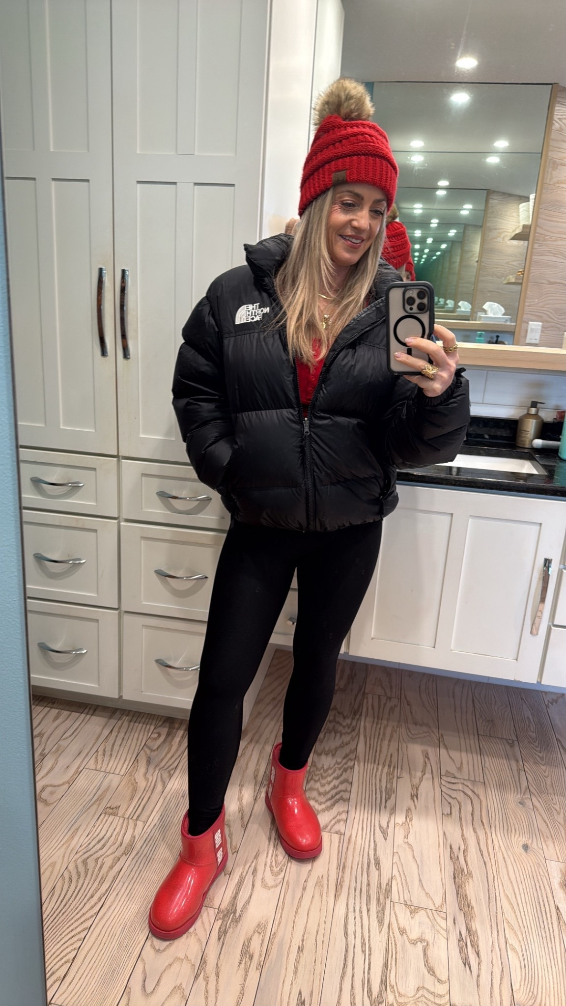 Snowy winter leggings outfit, cute and cozy, with a warm North Face puffer jacket, a red beanie hat and Ugg boots  

#LTKHoliday #LTKActive #LTKSeasonal