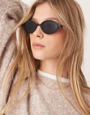ASOS DESIGN slim oval sunglasses in black | ASOS (Global)