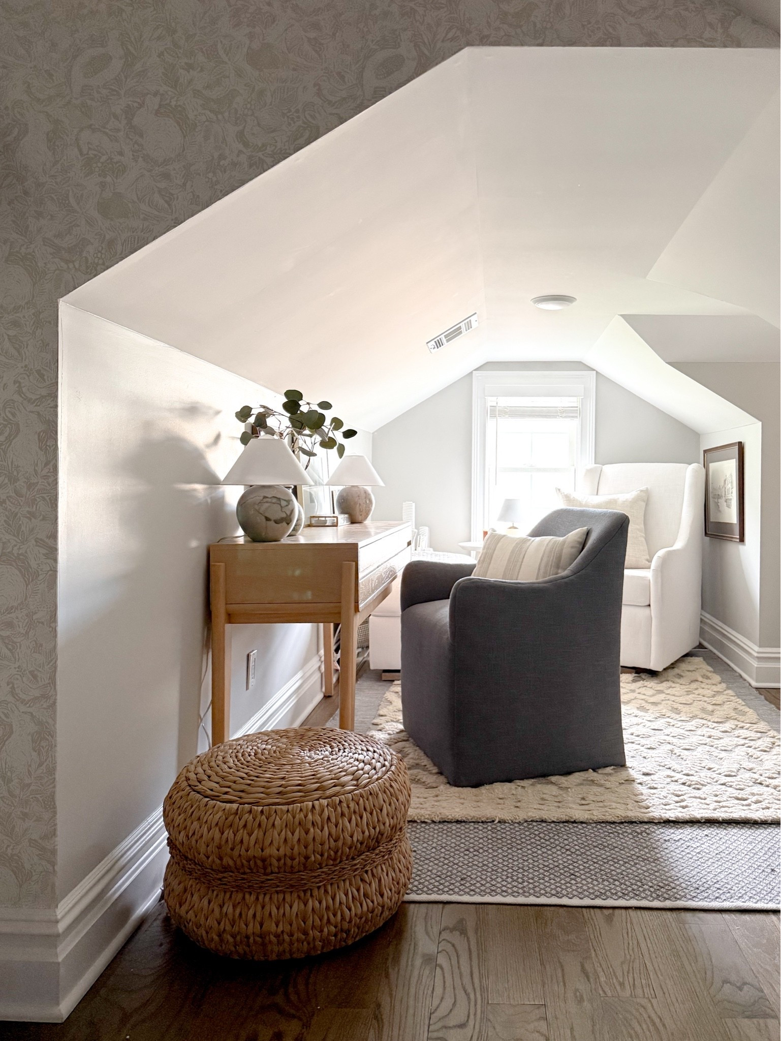 I carved out a tiny home office in this corner of our attic and while it’s definitely SMALL, it’s quiet and somewhere where I store samples, wallpaper and work without interruption. But I think I need  some wallpaper in here! Maybe something bold to play up all of the angles?! What do you guys think??

#LTKHome #LTKSeasonal #LTKdayinmylife