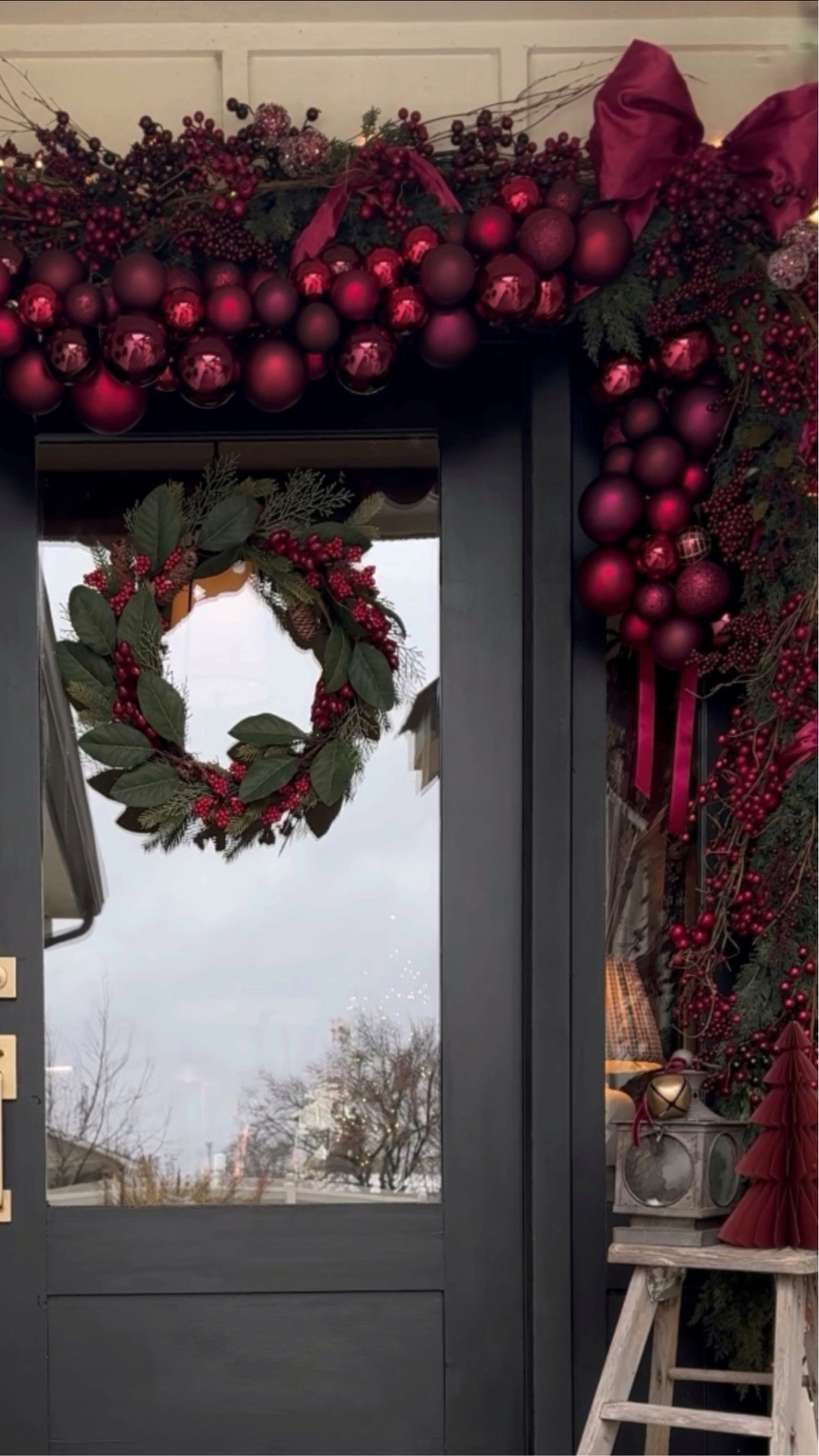 I loved creating this dramtic entry filled with Cedar Garland, berry Garland, berry picks, twigs and the DIY bubble garland. I created this drama by mixing red ornaments in different tones as well as different textures of ornaments. Don’t be afraid to mix up different textures and colors of red. I’m not sure the total number of ornaments that I used but I’m guessing it’s over 100. I did use two Cedar Garland strands 6 foot in length and 2 berry garlands.

#LTKSeasonal #LTKHoliday #LTKHome