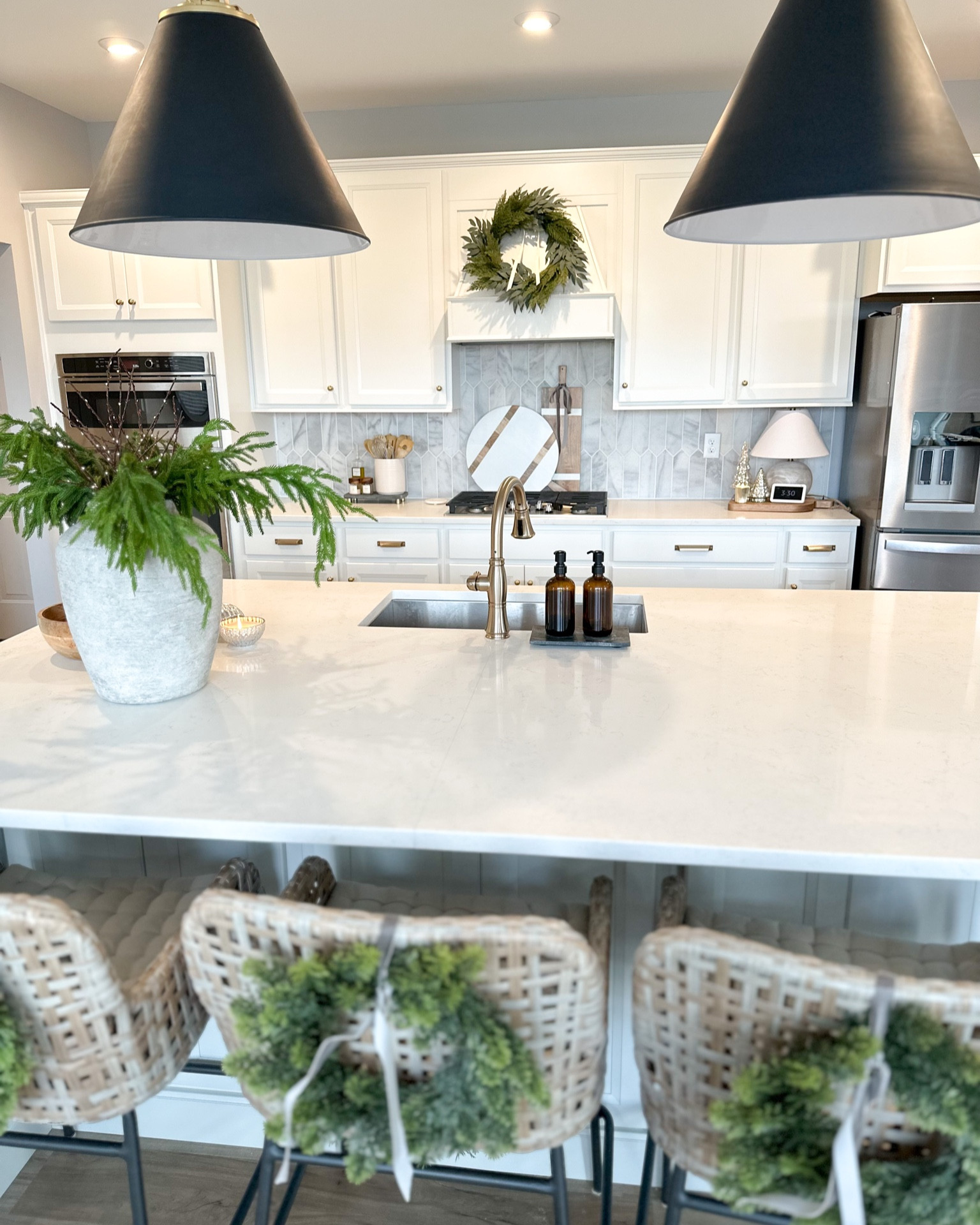 Holiday kitchen, Christmas kitchen decor, Bailey woven counter stool, Ballard designs Norfolk pine, rejuvenation pendant lights 

#LTKstyletip #LTKsalealert #LTKhome