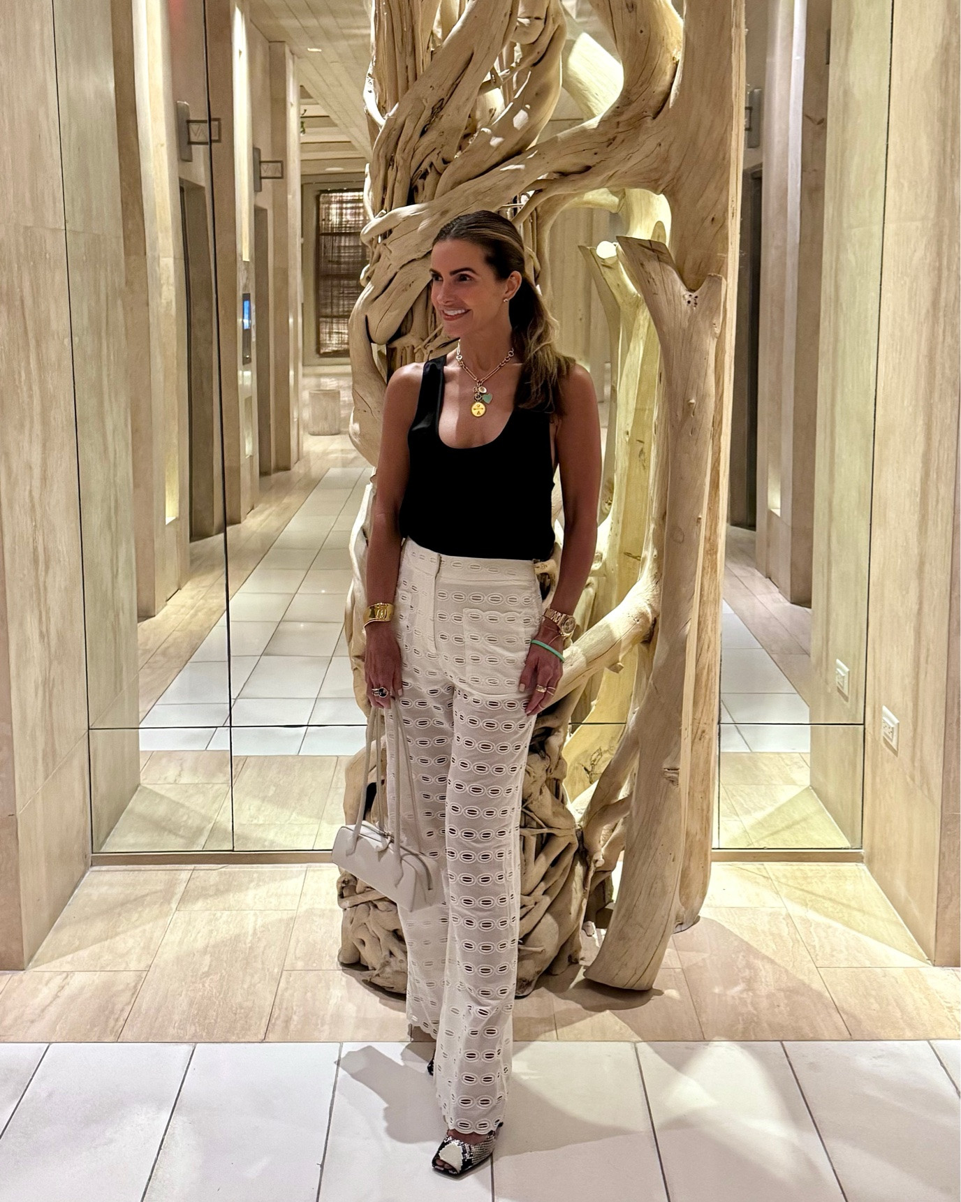 off to watch USA play at our fav carpaccio at balhour wearing my fav silk tank that i love & own in several colors + my chic eyelet white pants🖤🤍

both run tts im wearing a small

#LTKTravel #LTKdayinmylife #LTKSaleAlert