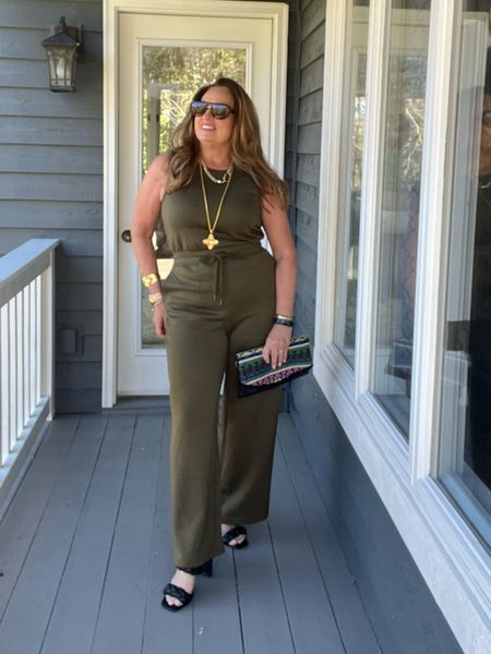The best traveling/versatile jumpsuit around. The quality knit fabric is  truly next level. I decided to dress it up a little with braided sandals and @julievos cuff and pendant.
My new retro aviator sunglasses are newest favorite. 

#LTKSpringSale #LTKfindsunder50 #LTKtravel