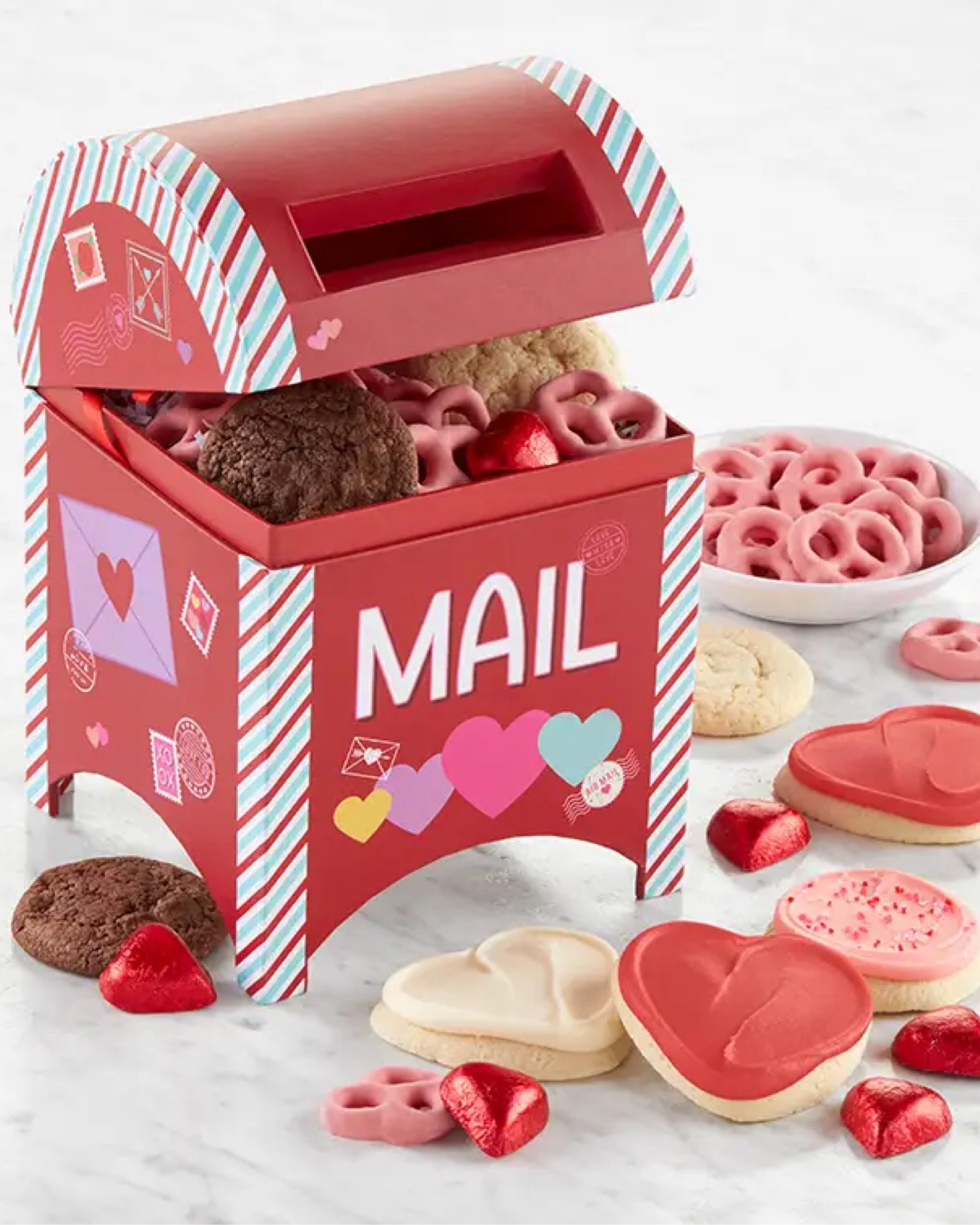 💝Valentine’s Day Delivered💝 Send some love to family and friends nearby or far away with this charming red mailbox filled with delectable treats. This sweet treat mailbox is filled with strawberry yogurt-covered pretzels, foil-wrapped chocolates, and Valentine’s Day cookies in a variety of wonderful flavors. Gluten free gift tower also available for delivery.

#LTKSeasonal #LTKGiftGuide