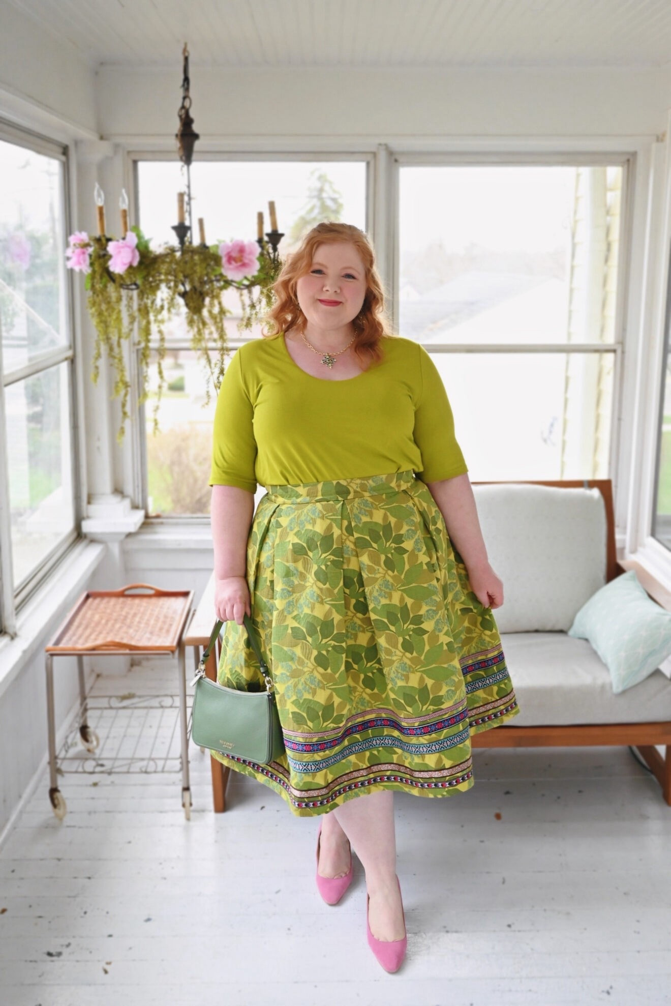 Springy Green Tee and Jacquard Skirt Outfit

This Layered Short Sleeve A-Line Tee (sizes 12/14-28/30; $54.95) comes in 15 colors including everyday neutrals and rich shades like this pistachio green, fuchsia, and teal. I’m wearing the size 16/18, and it’s a great fit with stretch to the fabric. I love this tee because it’s double-layered in the most luxurious soft jersey. I like the modest scoop neck and the elbow length sleeves for some coverage while still being wearable all spring and summer. So many tees are cheap and see-through nowadays, and this is a truly quality tee I plan to stock up on in several colors.

I’m wearing this Ribbon Trim Accent Skirt (sizes 12-32; $149.95) in the size 18, and it’s a great fit. There’s no stretch to the fabric or waistband, and the fabric is stiff and thick. It features a zipper and clasp up the back, along with large box pleats that give it a full A-line silhouette. The fabric has the weight and sheen of a beautiful brocade, with patterned ribbon trim along the hem of the skirt. I chose to pair the skirt with a matching tee in pistachio green, but the colorful ribbon accents give you lots of other options that this tee also comes in: fuchsia, teal, purple, or pink.

#LTKMidsize #LTKootd #LTKPlusSize