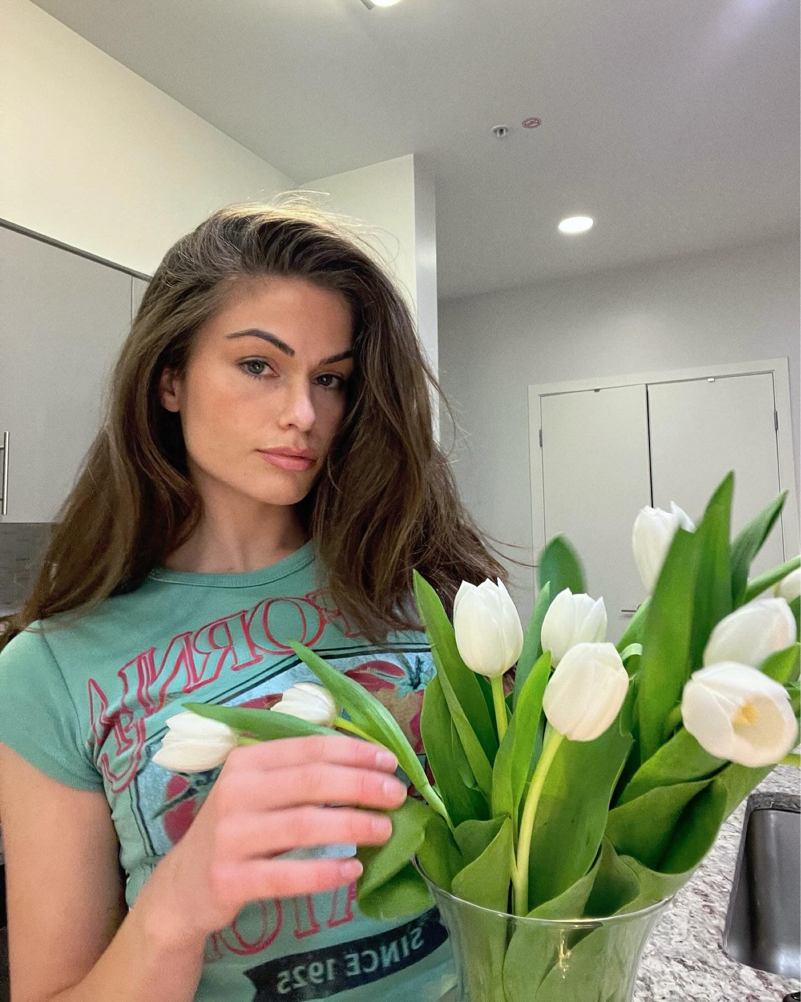 Urban Outfitters graphic tee for casual Spring style. A touch of nature with vibrant white tulips—the perfect blend of comfort and class. Urban Outfitters Tee, White Tulips, Stylish Kitchen, Modern Elegance 

#LTKStyleTip #LTKBeauty #LTKSeasonal