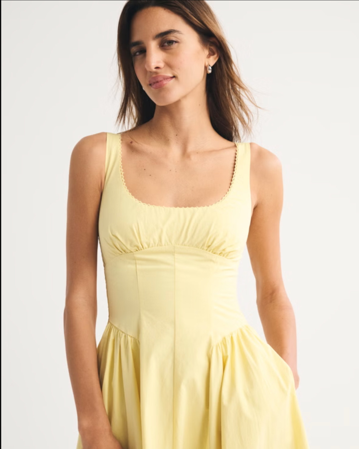 Effortless and flattering 🤍 The Abercrombie A&F Bra-Free Dylan Midi Dress is part of their bra-free collection, designed with built-in support (removable pads!) so you can skip the bra. It features a scoop neckline with delicate picot trim, adjustable straps, back smocking, and a dipped waist that flows into the prettiest skirt. The classic poplin fabric makes it perfect for everyday wear, brunch, or dressing up with heels ✨ 

 #LTKSpringSale #LTKootd #LTKSaleAlert