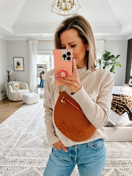 Who knew a fanny pack could be so chic? This tan rattan Clare V. Grande Fanny pack is perfect for spring and summer.

Also, my Pistola star sweater is back this year in a new color! I wear it ALL the time. It’s oversized, but not too big, and 100% cotton so it’s not itchy. I’m wearing XS.

#LTKstyletip #LTKSeasonal #LTKitbag