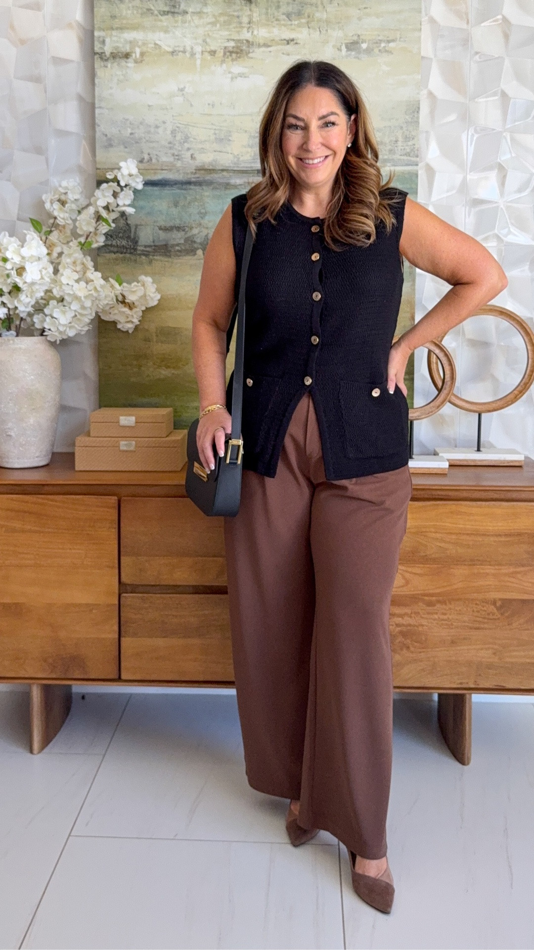 Fall workwear outfit idea 🖤 Black textured knit sweater vest with gold buttons and patch pockets, styled with rich brown wide-leg trousers, a black crossbody bag, and brown suede pumps. A black + brown business casual look and teacher outfit that works all season.

Sizing: Wearing Large in vest, pants tts, L

#LTKWorkwear #LTKOver40 #LTKSeasonal