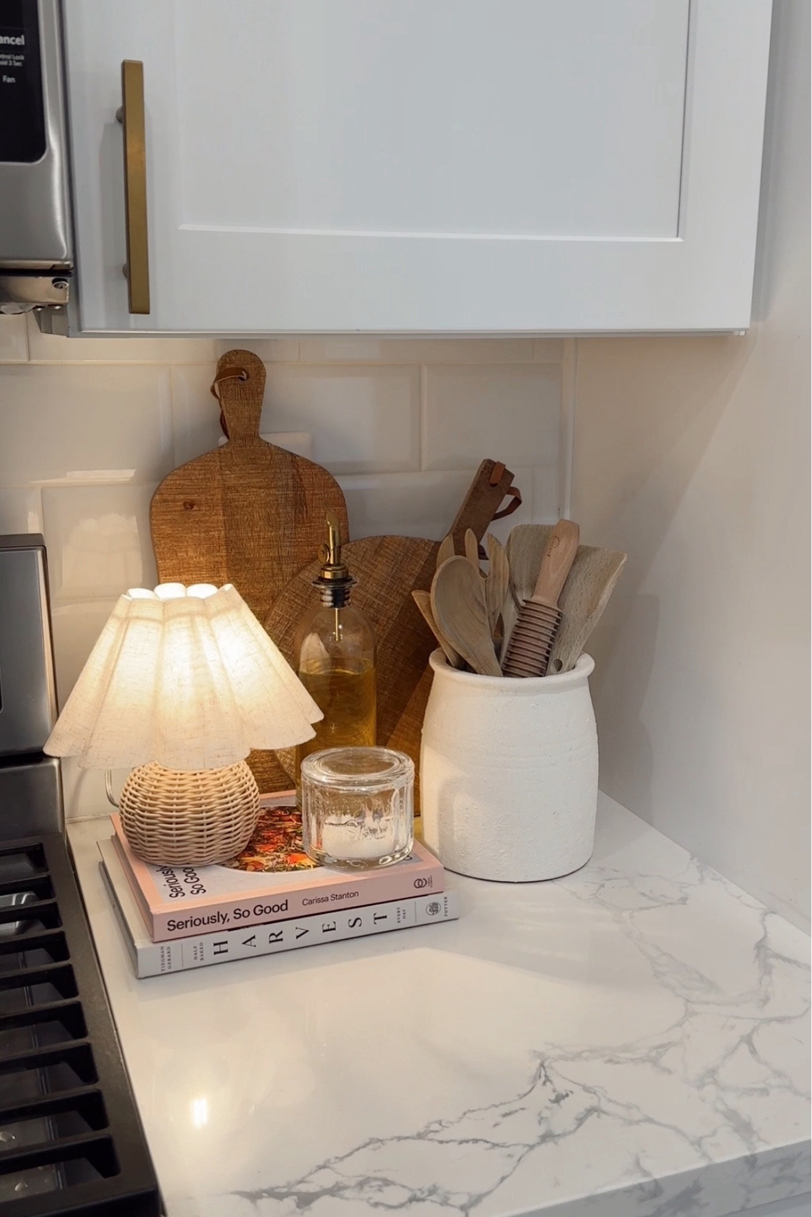 By the stove decor, kitchen counter decor,  cooking station, utensil holder, cookbooks, vintage bread boards 

#LTKHome #LTKParties #LTKFindsUnder50