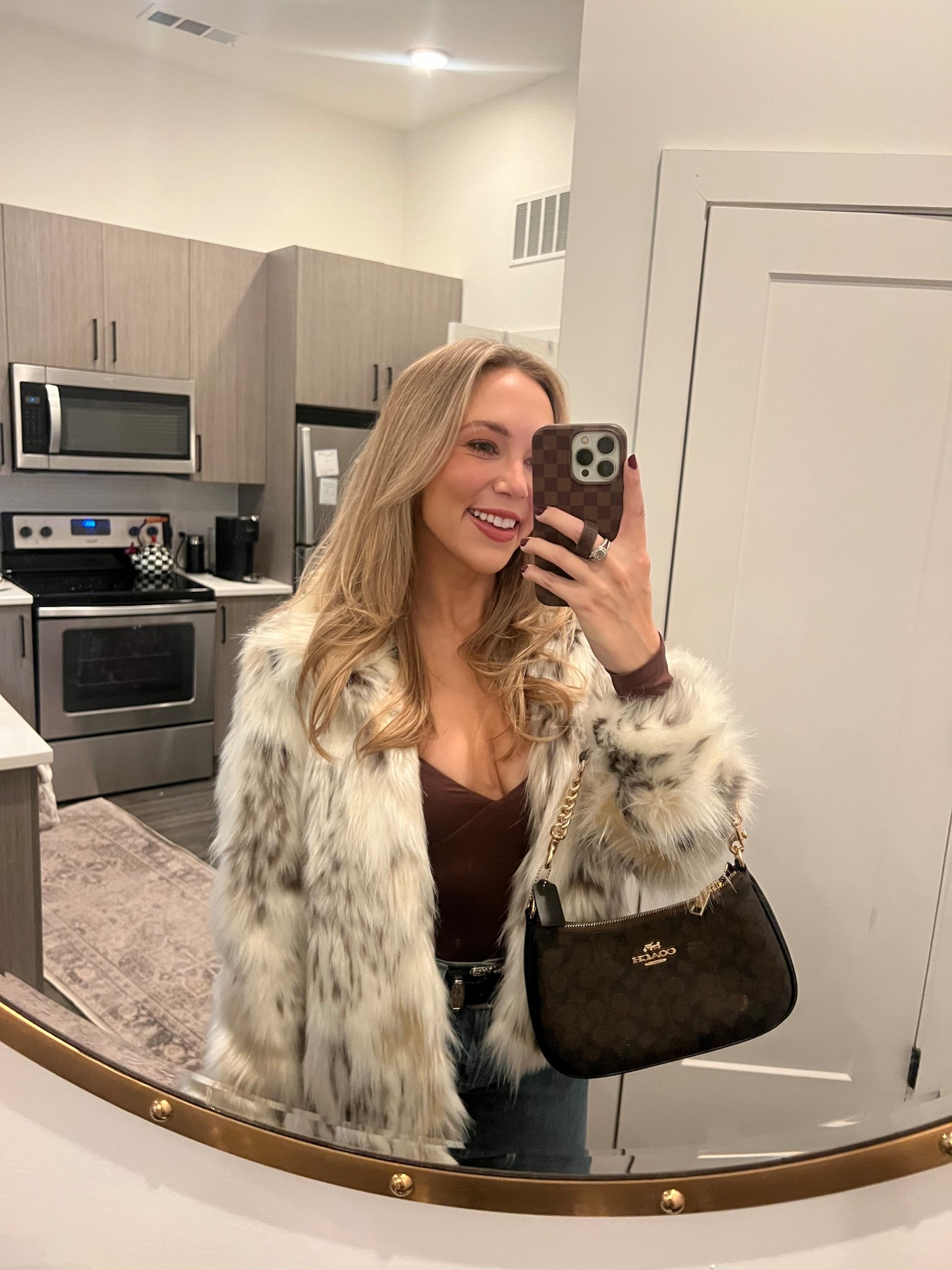 Winter outfit, faux fur coat, brown bodysuit, black belt, coach handbag 

#LTKdayinmylife #LTKSeasonal #LTKootd