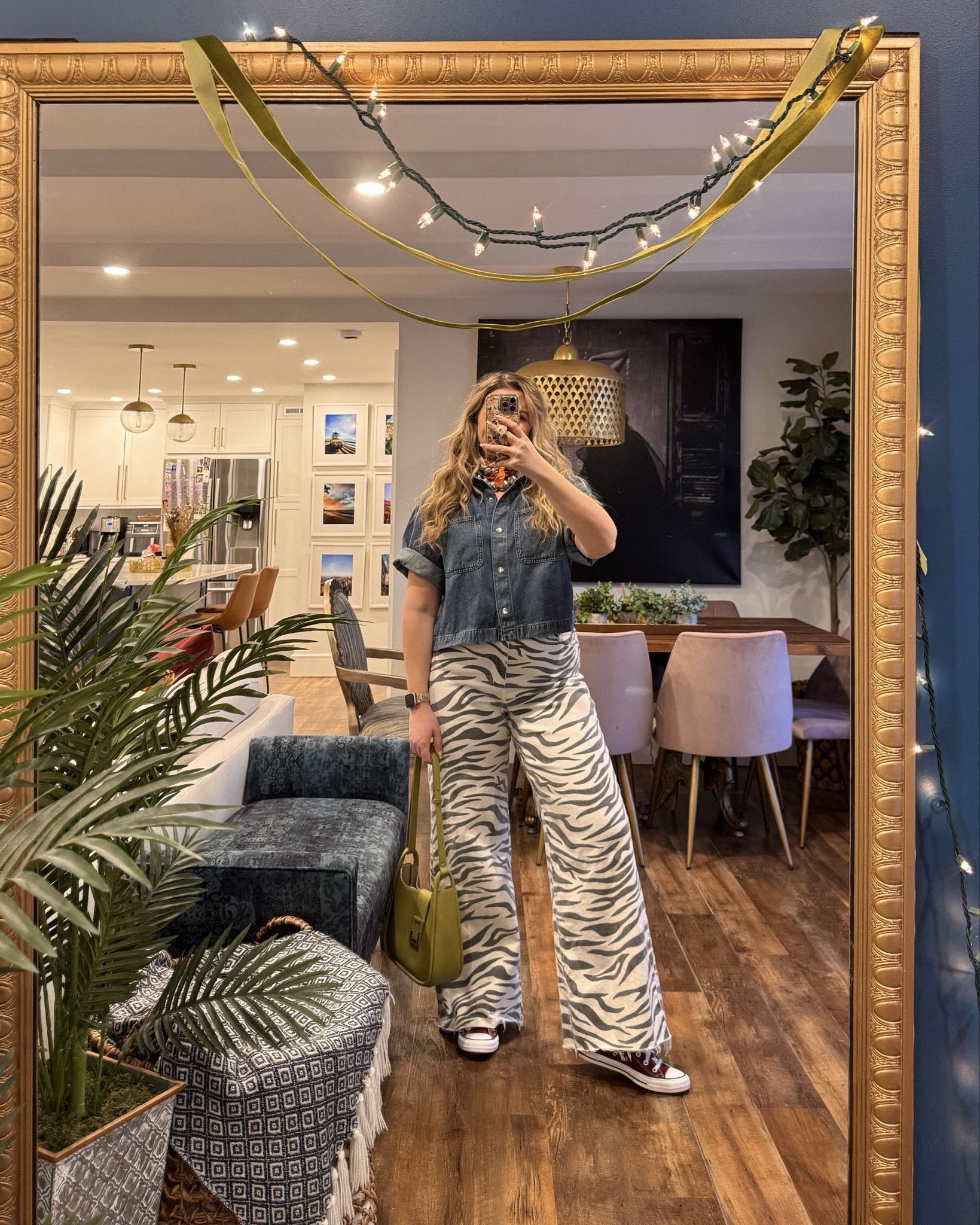 Spring outfits 2026. Obsessed with this funky Spring outfit! Madewell boxy airy denim short sleeve button up wearing a large for an oversized fit (currently on sale 25% off). Daze Denim Far Out High Waist Wide Leg Jeans in Zebra wearing a 31 but probably could've gotten a 30. 

 #LTKFestival #LTKootd #LTKMidsize