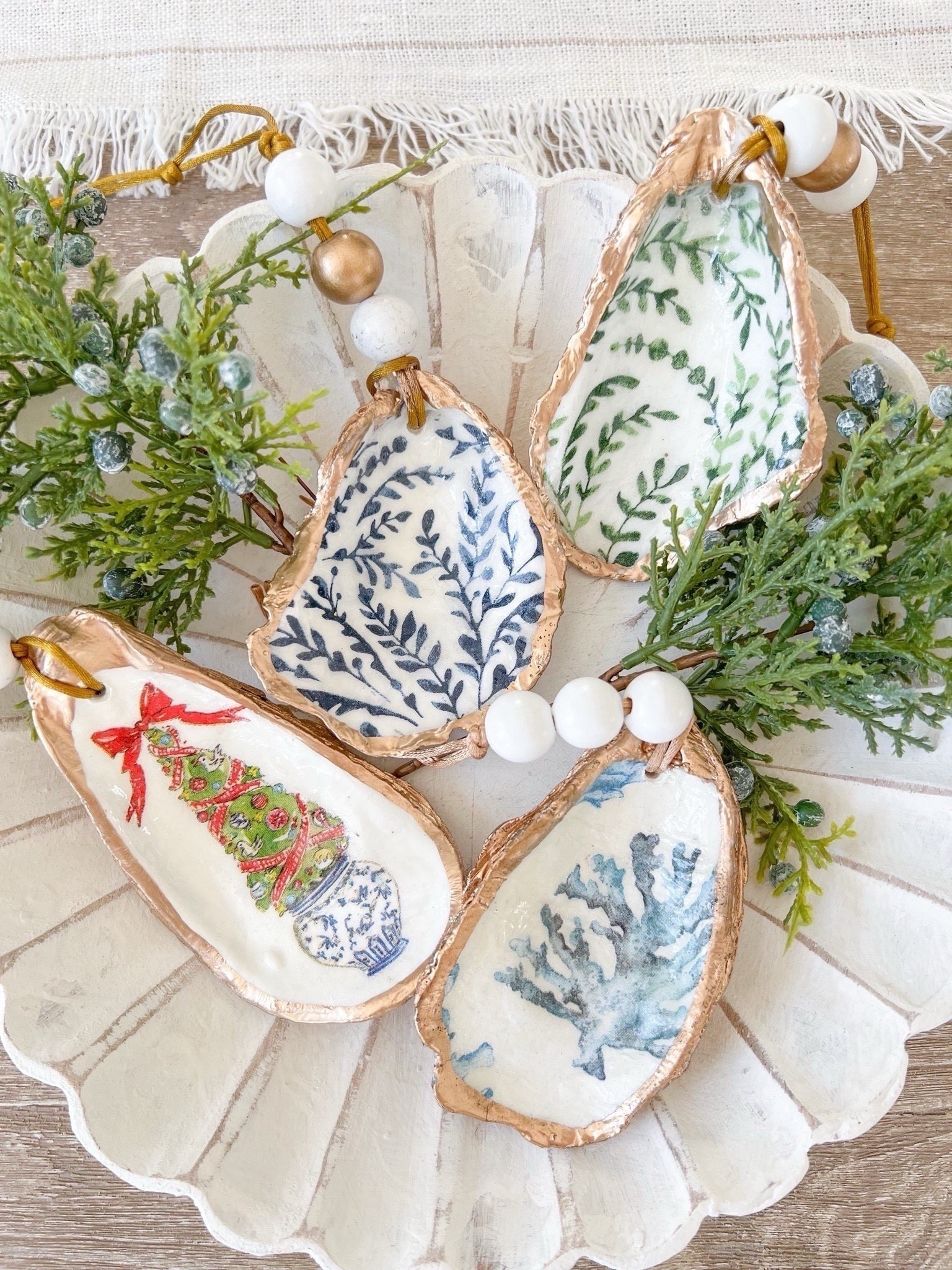 If you're looking to gift or add a few special ornaments to your tree this year, these oyster shell ornaments are beautiful! Choose from Serena & Lily inspired ornaments, or a more classic Christmas look!
-
coastal christmas decor, coastal christmas ornaments, oyster ornaments, serena & lily ornaments, hand-painted ornaments, handmade ornaments, Etsy decor, coastal home decor, beach house decor, blue and white christmas decor, gold ornaments, holiday ornaments, tree decor, coastal tree decor, locally made ornaments

#LTKHoliday #LTKFindsUnder100 #LTKHome