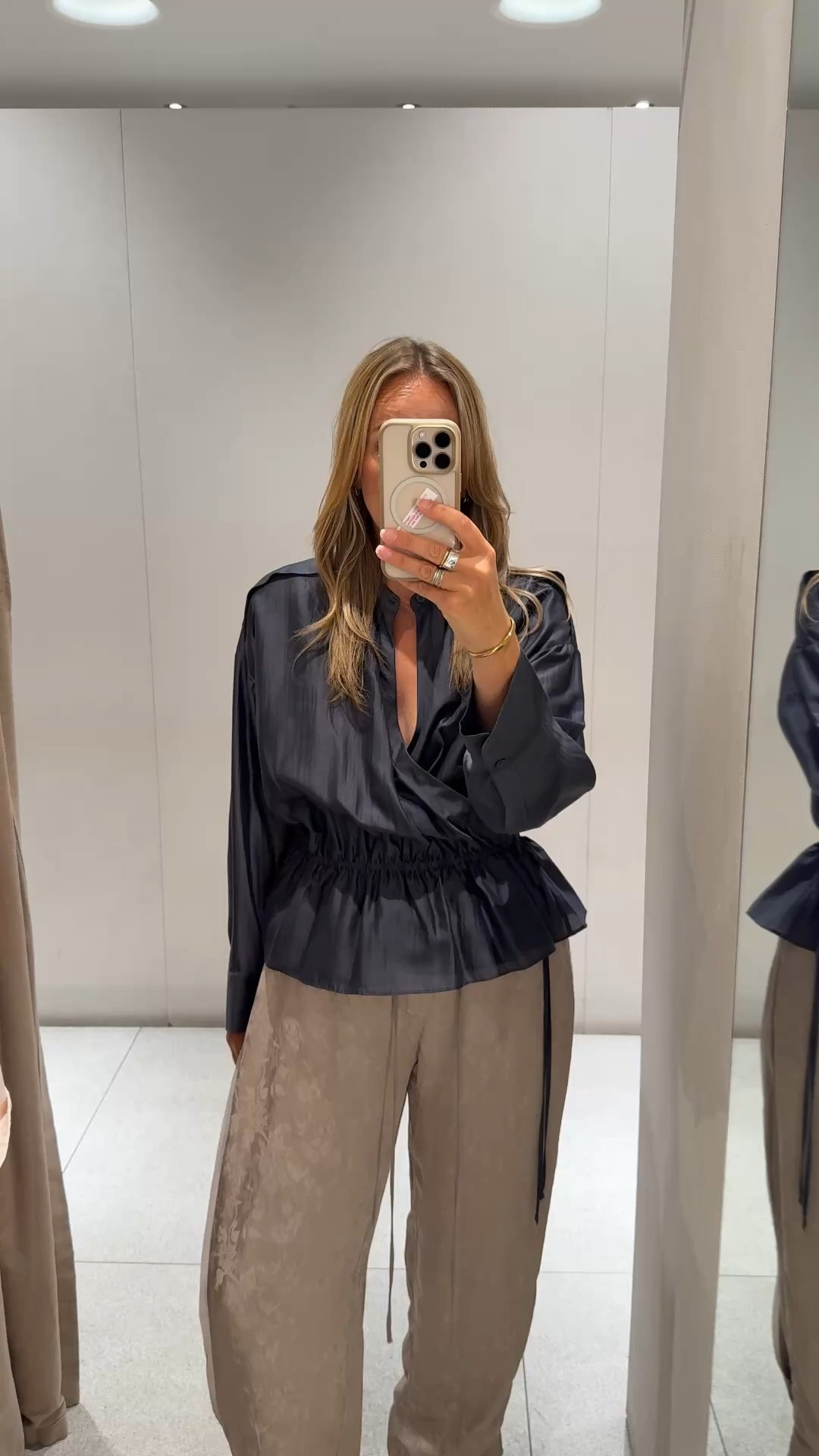 Lovely blouse in Zara just now 
Slate blue grey 
Light fabric with lustre
Wrap design , elasticated waist . 
I’m wearing a large - it’s generous and I could probably get away with the medium. 

I’d style with a tailored trouser or jean

#LTKdatenight #LTKautumn #LTKsummer