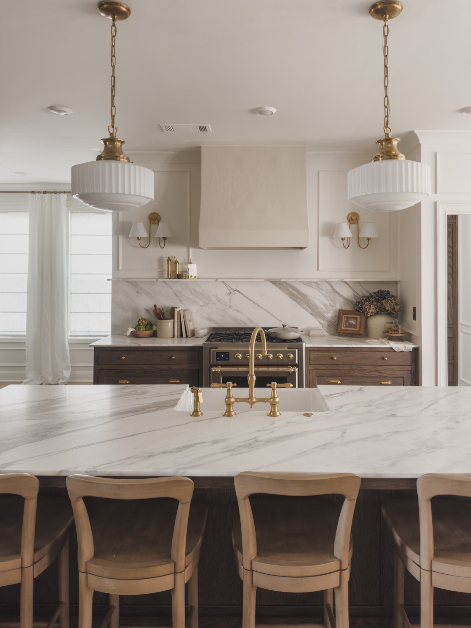 A closer look at my kitchen refresh bringing in these stunning gold accents like my Visual Comfort pendant lights and Newport Brass faucet for a statement look, while incorporating just the right amount of warmth with these deeper wood toned cabinets.

Home finds, open concept kitchen, spring refresh, neutral wood tones, gold pendant lighting, double wall sconce, barstool, kitchen details, oil dispenser, faux florals, Pottery Barn style, kitchen faucet, Wayfair, McGee and Co, look for less, linen curtain, roman shades, Two Pages, shop the look!#LTKStyleTip

#LTKSeasonal #LTKHome
