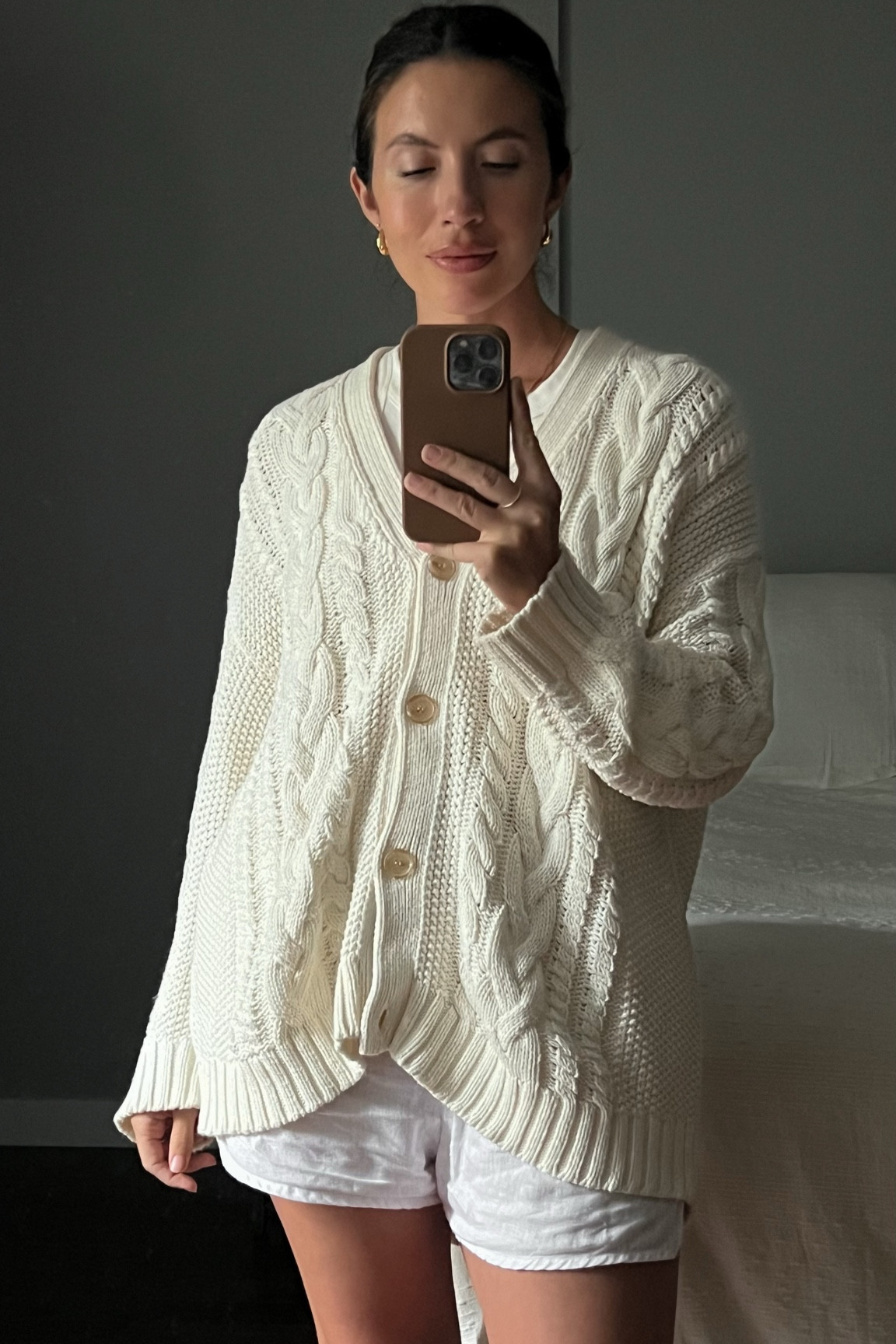 Cozy in cable knit at home because there’s a fall chill in the air. Paired with my go-to tank and linen shorts.

#LTKstyletip #LTKSeasonal