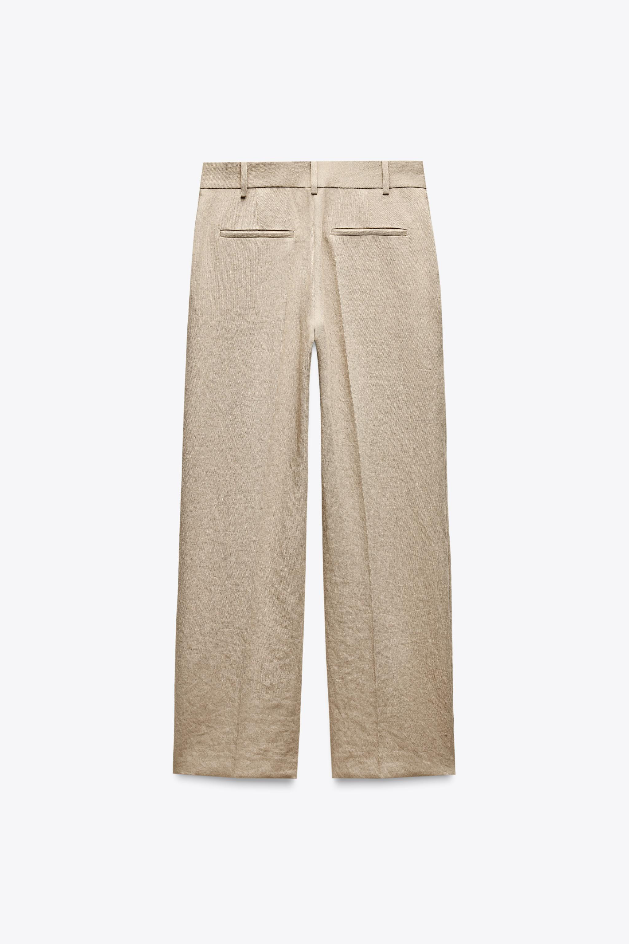 High-waisted pleated pants. Front pockets and faux back welt pockets. Straight leg. Front zip, in... | Zara US