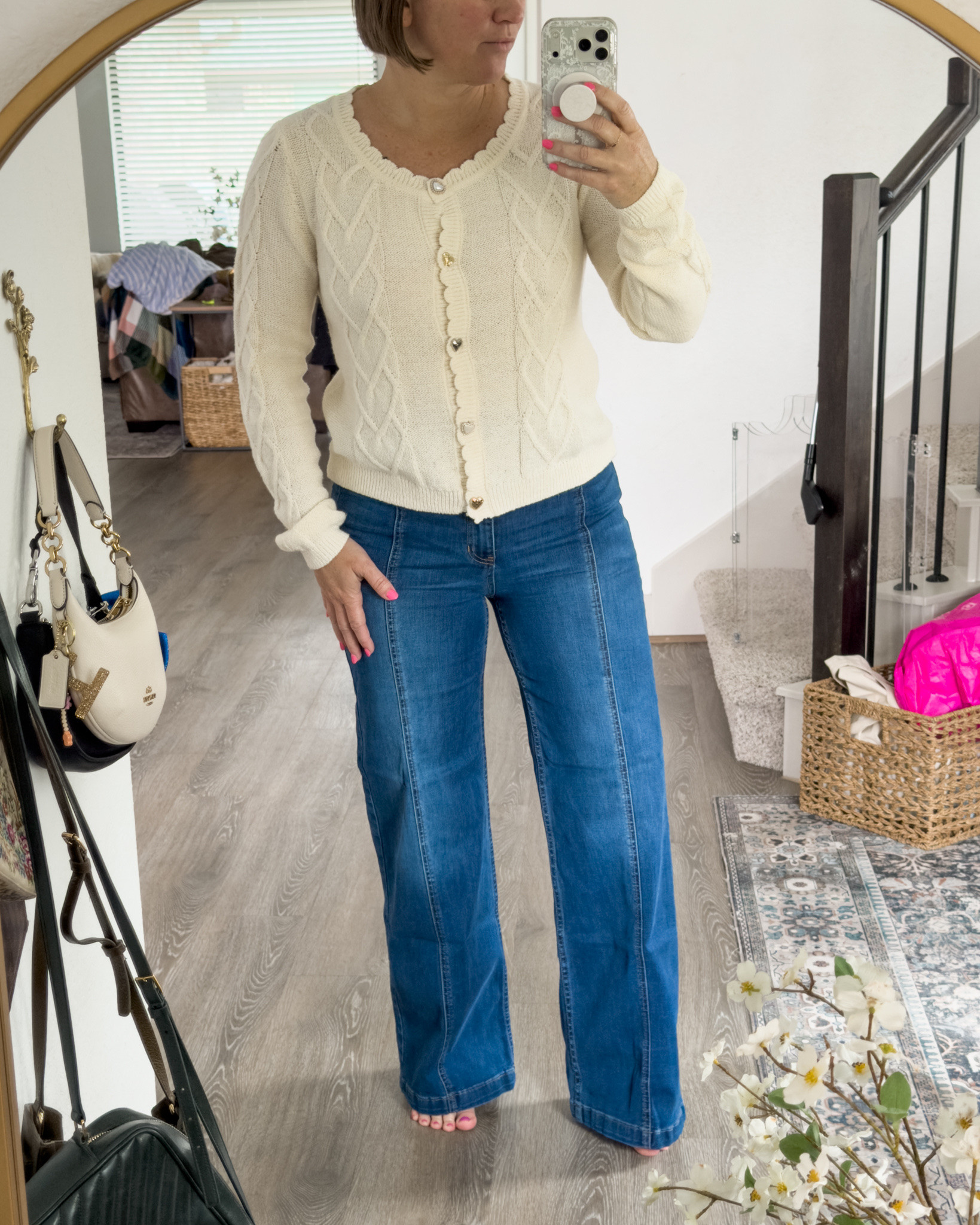 Soft, feminine, and effortlessly put together 🤍✨

This cream cable knit cardigan is the perfect throw-on for everyday—lightweight, flattering, and the sweetest little details (those buttons 😍). Paired it with my favorite high-rise flare jeans for an easy, polished look you can wear anywhere.

Casual, comfy, but still cute… exactly my vibe 💙

#LTKstyle

#LTKmomlife