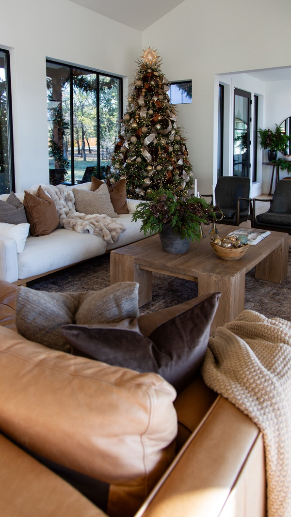 A warm, cozy living room made even better by Christmas — and almost everything you…