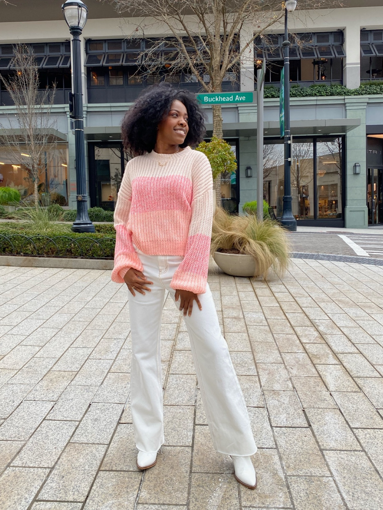 Cozy winter outfit, colorful sweater, white denim