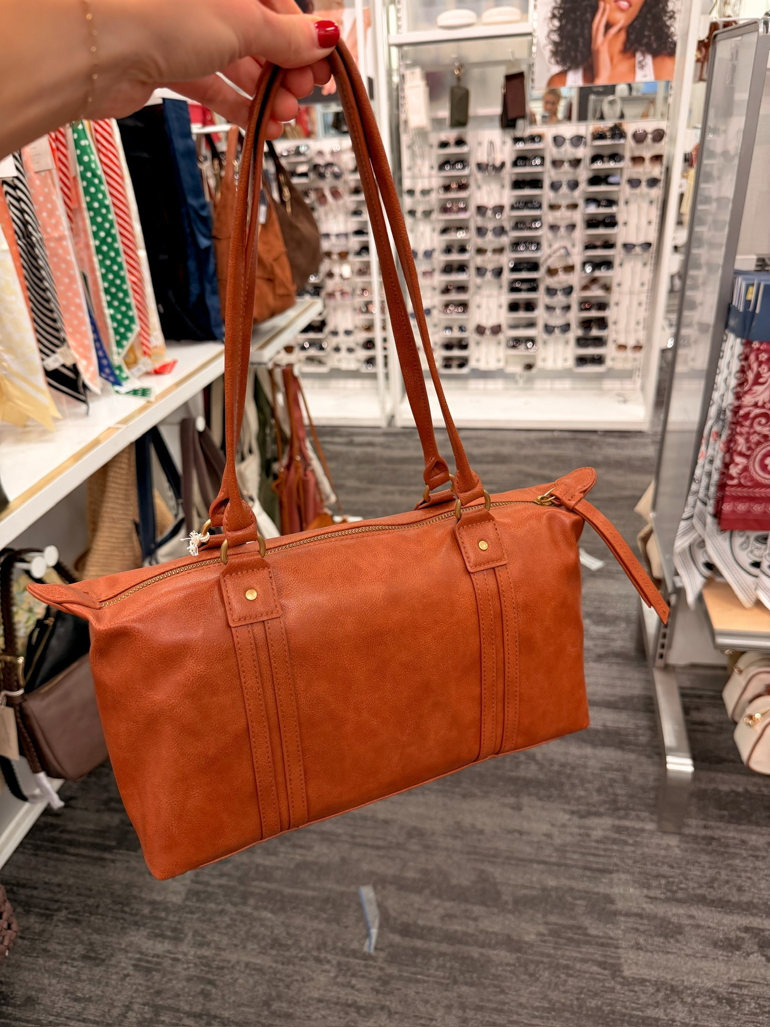 Found this cognac leather duffel bag at Target and had to snag it 🤎 The gold hardware and structured shape make it feel so much more expensive than it is — perfect for a weekend trip or even as an everyday tote. Linking below!

#LTKootd #LTKTravel #LTKSeasonal