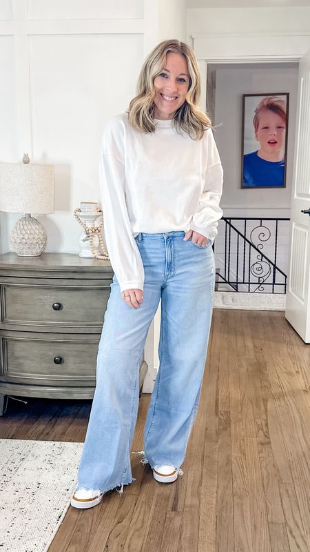 Love this fit. Perfect for now into spring. This sweatshirt is so comfy but a nice thin material so it will be great for warmer weather. These jeans are life. 
Small top
Size down 1 in jeans. I’m in a 6 regular. 


#LTKSpringSale #LTKstyletip #LTKfindsunder50