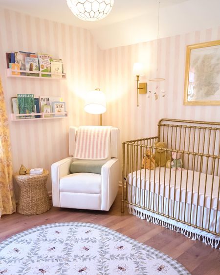 Our daughter’s Winnie the Pooh inspired nursery 🧸🍯🎀 Linked what I could! Mobile is custom made from a seller on Etsy and the framed map was purchased in the UK. 

#nursery #nurseryinspo #poohnursery #girlnursery #englishcountry #winniethepooh
