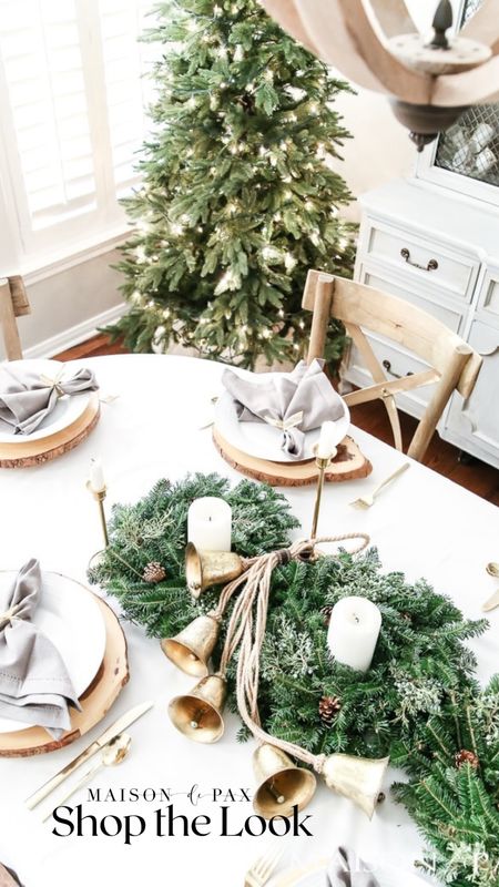 As Christmas guests will start gracing your home soon consider this easy stunning table scape to wow them. Beautiful garland, brass bells, candles chargers 

#LTKhome #LTKHoliday #LTKSeasonal