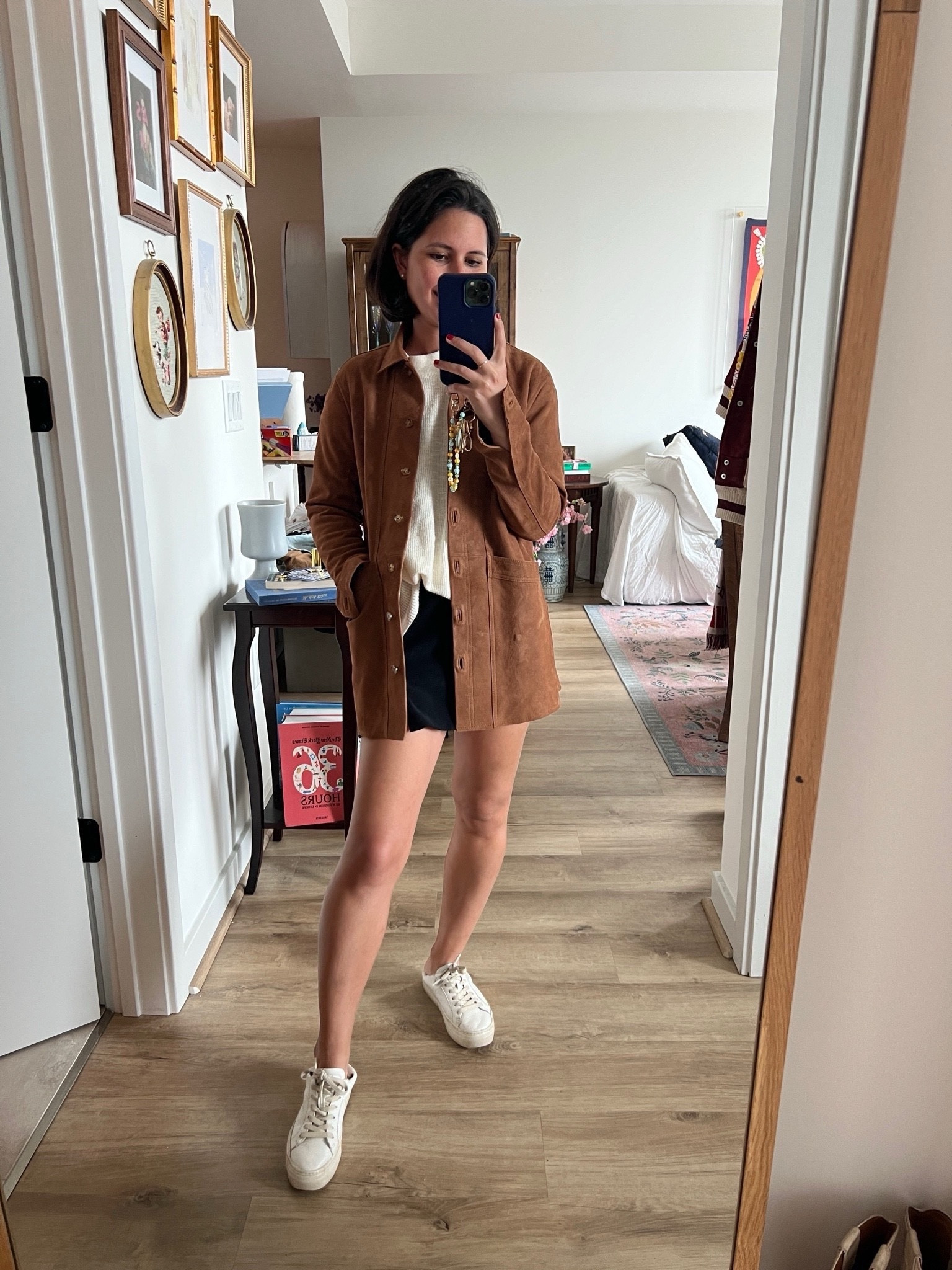 Styling my fall favorites with this beautiful Sezane suede jacket in a rich caramel brown, sized up to an XS for that perfect oversized look! Paired with a chic black Amanda Uprichard skirt and a cozy Free People sweater for effortless layering. Love how this look blends textures for a casual yet elevated vibe. Perfect for fall days and easily transitional to winter. Think Sezane suede jacket, oversized outerwear, Free People sweater, fall layering, Amanda Uprichard skirt, autumn outfit ideas, neutral tones, and cozy style essentials. 

 #LTKSeasonal #LTKFindsUnder100 #LTKStyleTip