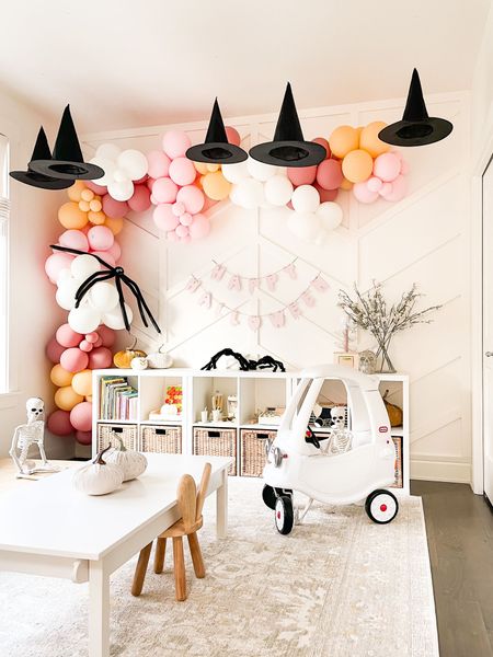 Halloween playroom for toddler, hanging witches hats, balloon garland, hair spiders, skeletons, Halloween decor, spooky decor for kids, toddler play table, playroom rug, playroom storage


#LTKHalloween #LTKkids #LTKhome