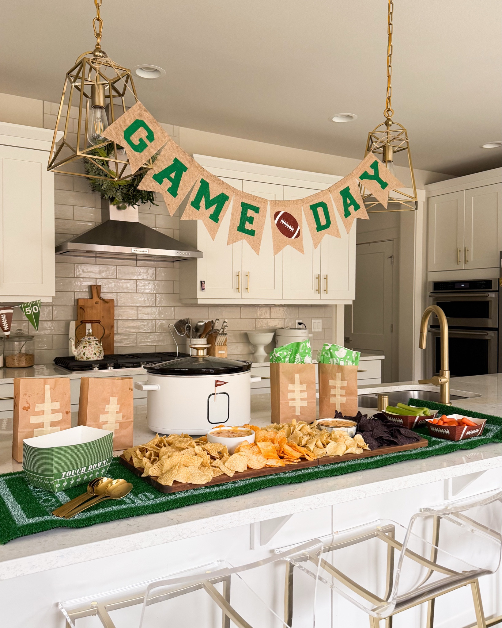 Game day queso chip bar! Game day decor set up in kitchen

Game Day Amazon Finds! Football turf table runner, slow cooker, bar stools, football party supplies, paper lunch bags, foldable charcuterie board, velveeta cheese, game day shirt 

#LTKHoliday 

#LTKFindsUnder100 #LTKHome #LTKSeasonal