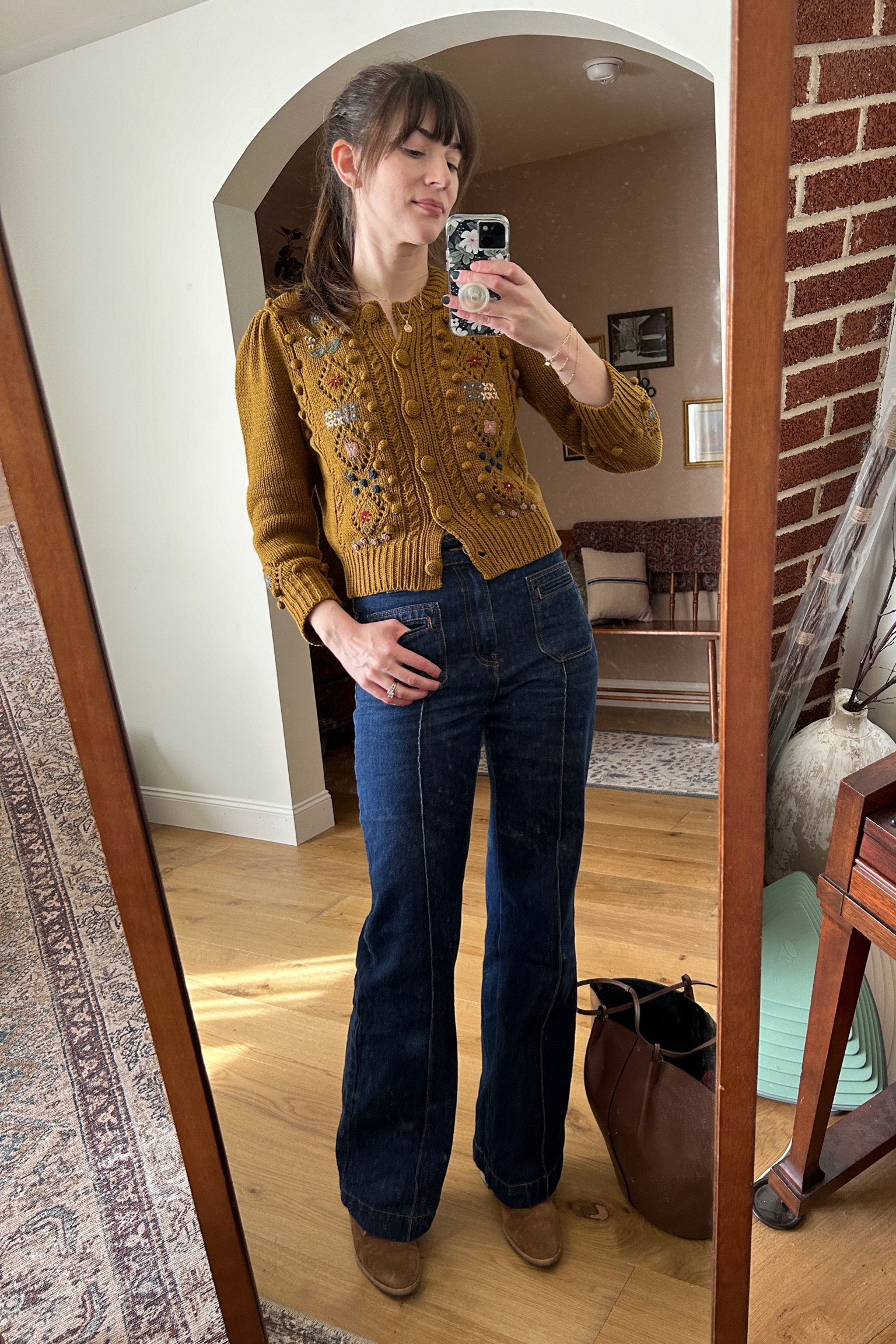 Embroidered knit cardigan from #Doen with denim wide leg trousers from #sezane. Shop a similar look below  