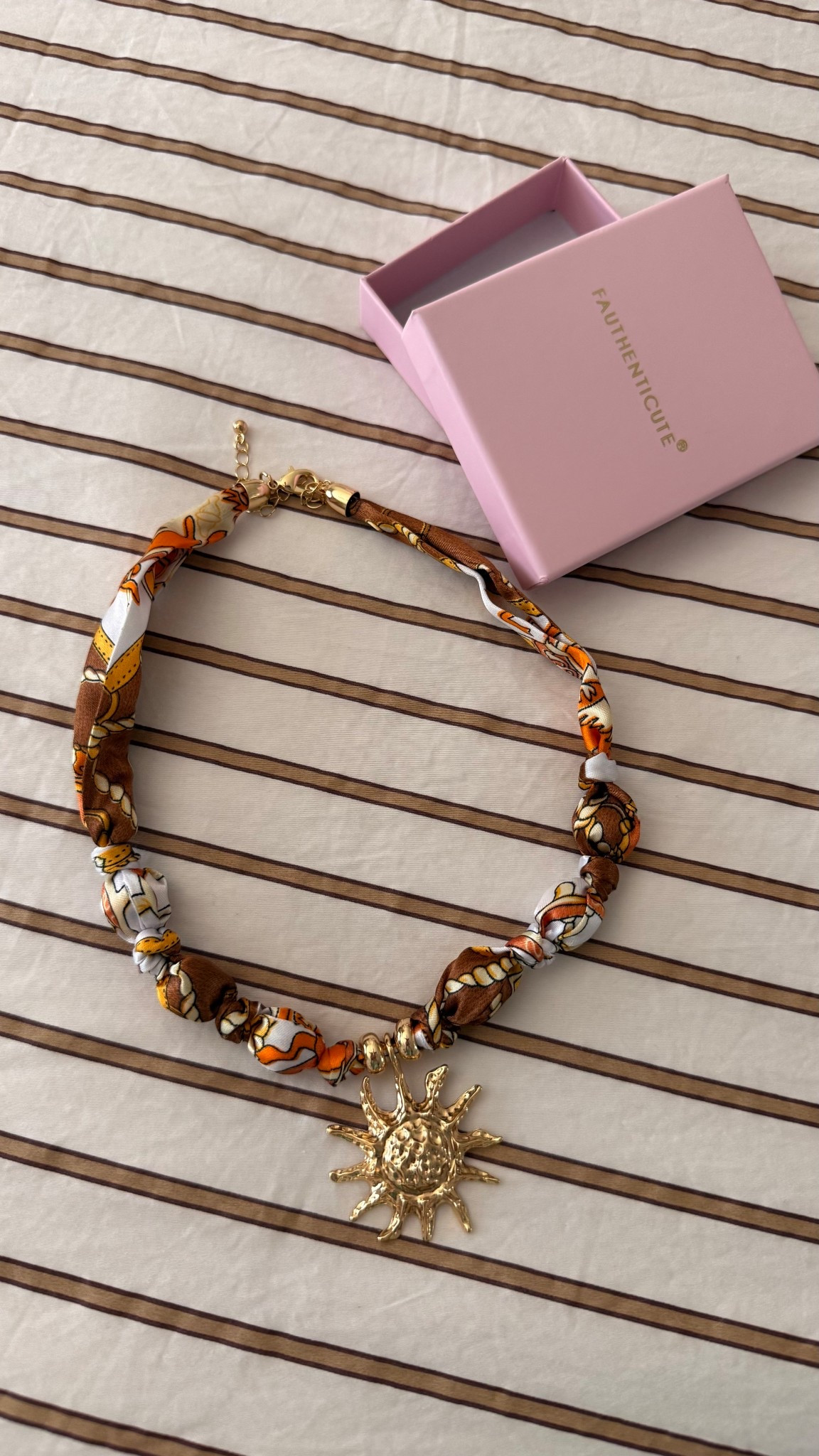 The perfect orange and gold scarf necklace for spring and summer, with cutie gold Sun charm!

#LTKgrwm #LTKSeasonal #LTKootd