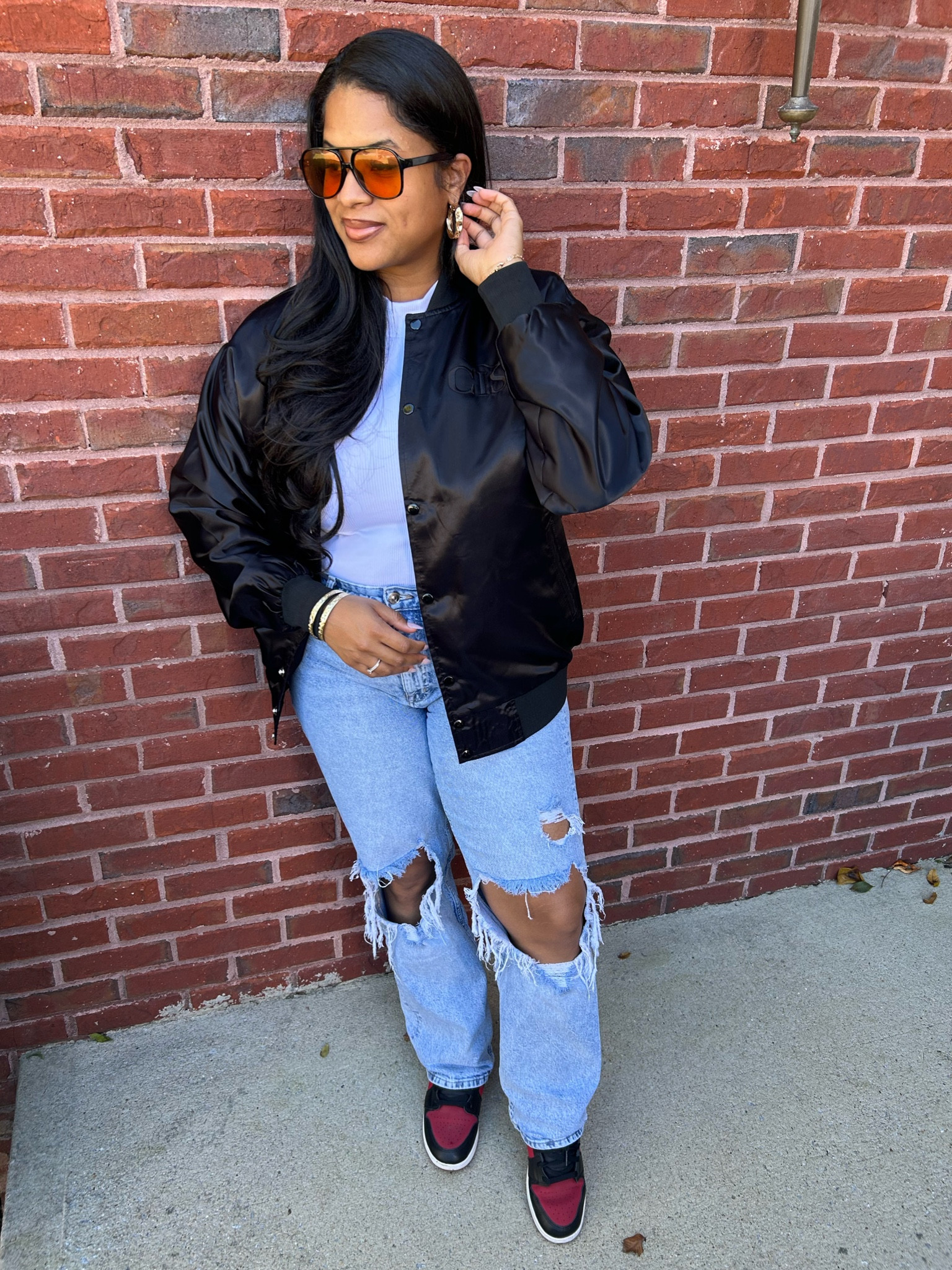 Casual fall outfit. Love Bomber jackets this fall. They are on trend. Wearing ripped jeans, Jordan 1s and my fave pair of Amazon shades. #falllooks #falltransitionoutfits 

#LTKstyletip #LTKxPrime