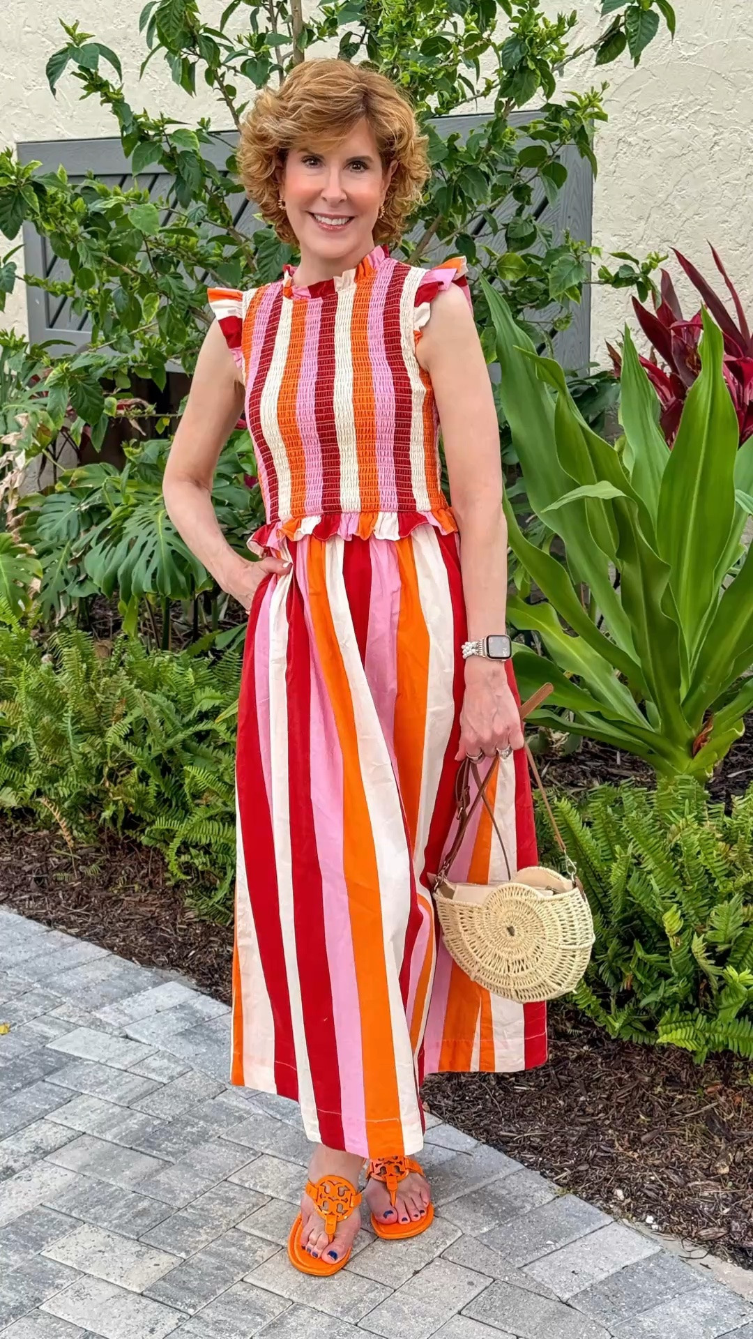 This colorful striped dress is such an easy throw-on-and-go piece, with a flattering A-line shape, smocked bodice, and the prettiest little flutter sleeves. It’s lightweight, comfortable, and perfect for everything from vacation days to casual dinners. I paired it with Tory Burch orange Miller sandals and a nautilus shell crossbody to make the look fun and extra beachy. For church, I paired it with these block heel sandals that truly go with everything and a fun summer bag. The compliments kept coming!

#LTKTravel #LTKWedding #LTKOver40