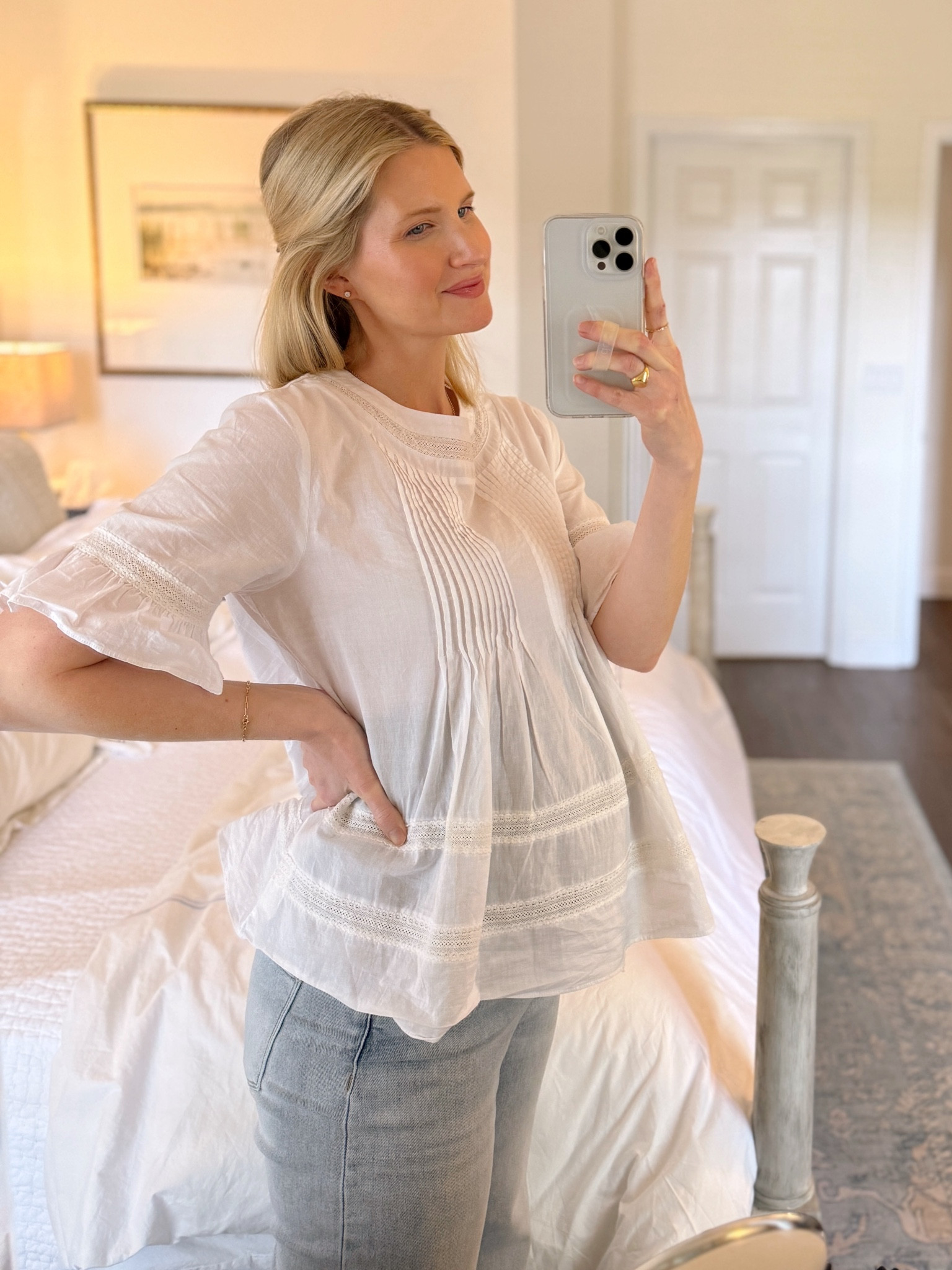 The prettiest white blouse from Shopbop wearing a size large to accommodate baby bump! And my favorite wide leg light wash maternity denim. 

#LTKSeasonal #LTKbump #LTKfindsunder100