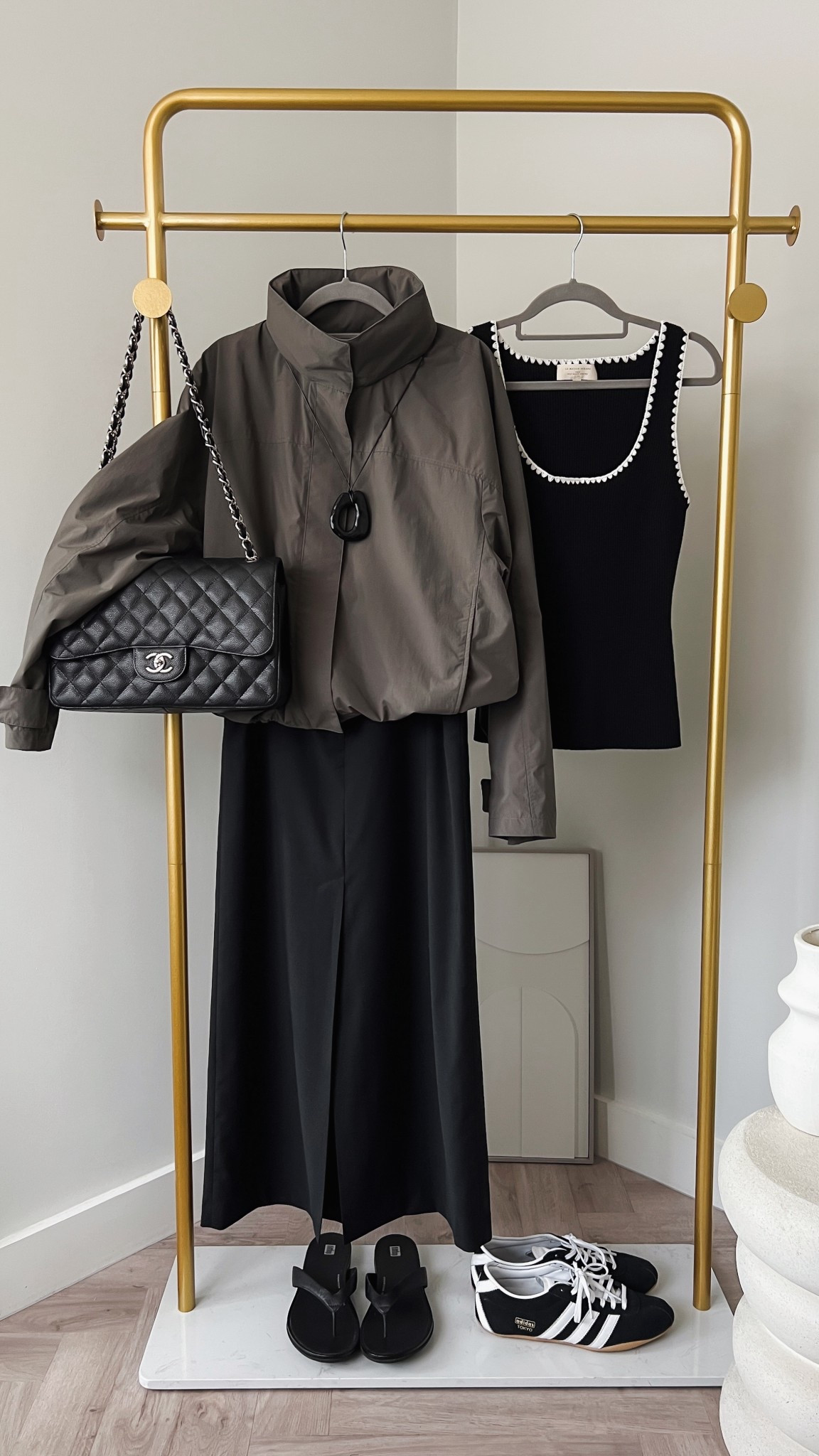 Minimal windbreaker outfit - high neck bomber jacket - Uniqlo - black maxi skirt - Fitflop Gracie leather flip flops - vintage Chanel classic maxi flap - Sezane vest top - minimal chic summer to autumn outfit - adidas Tokyo trainers for when dog walking 

#LTKsummer #LTKautumn #LTKuk