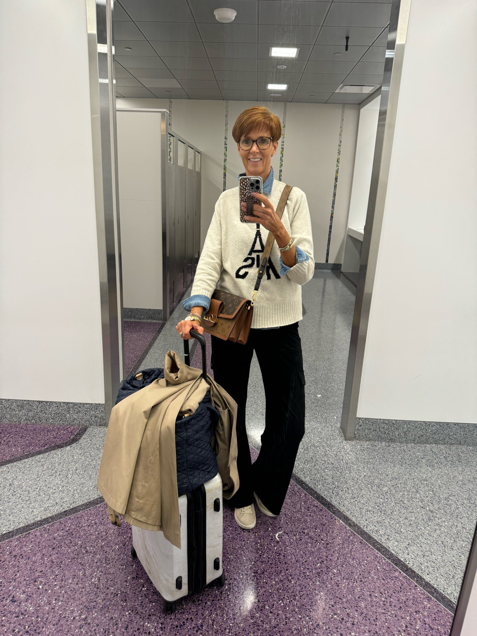 Paris travel outfit.
Comfortable but put together in a denim shirt, sweater and black pants.

#LTKTravel #LTKFindsUnder100 #LTKStyleTip